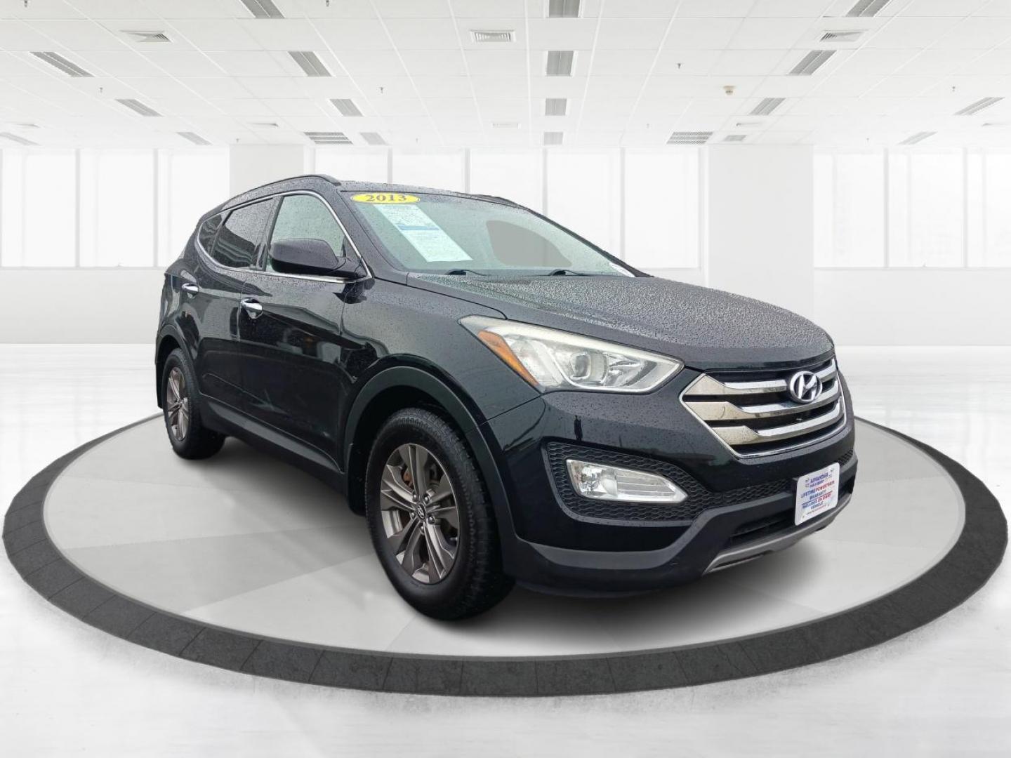 2013 Twilight Black Hyundai Santa Fe (5XYZUDLB5DG) with an 2.4L L4 DOHC 16V engine, 6-Speed Automatic transmission, located at 1951 S Dayton Lakeview Rd., New Carlisle, OH, 45344, (937) 908-9800, 39.890999, -84.050255 - Photo#0