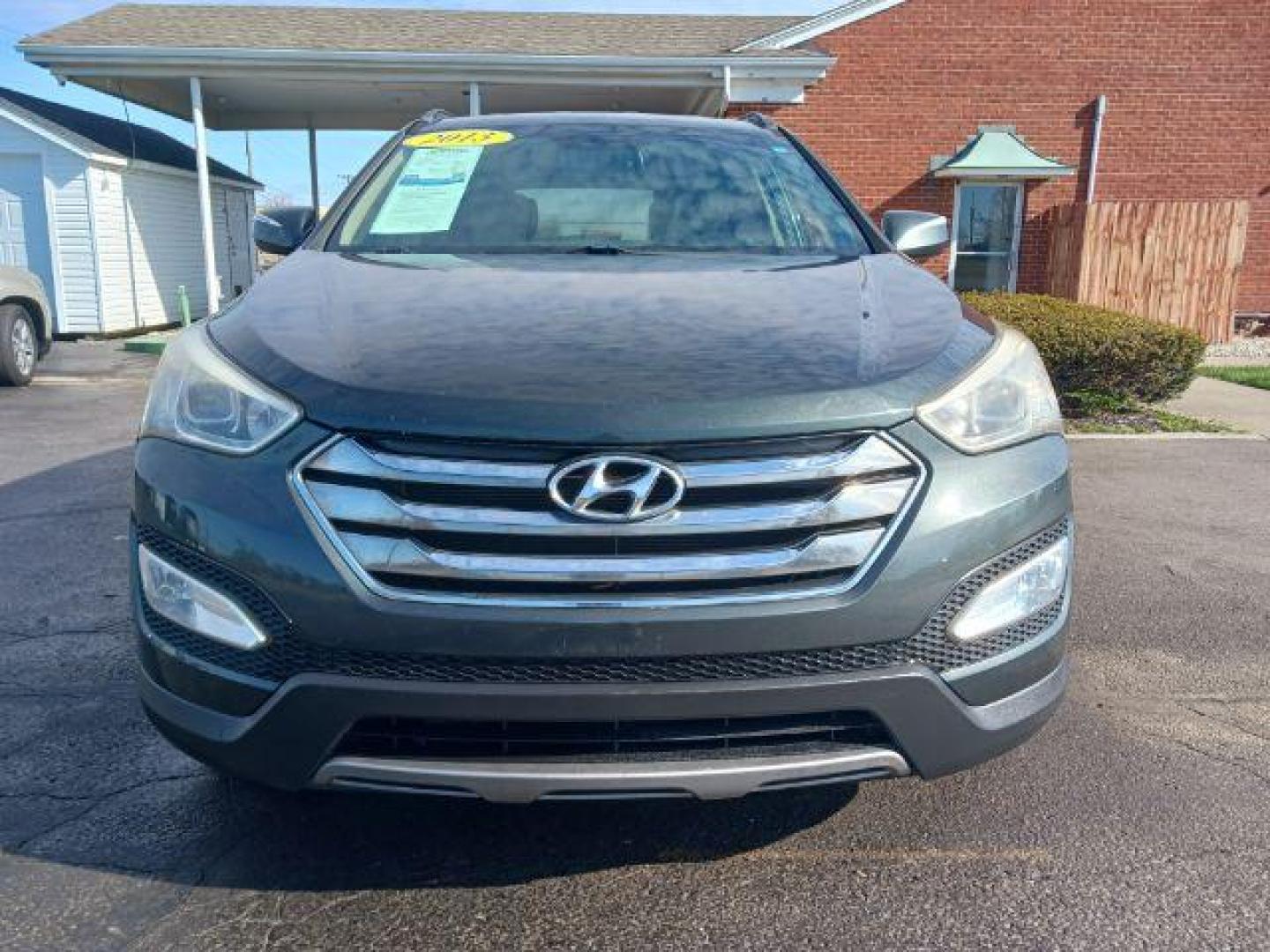 2013 Juniper Green Hyundai Santa Fe Sport 2.4 FWD (5XYZU3LB8DG) with an 2.4L L4 DOHC 16V engine, 6-Speed Automatic transmission, located at 1951 S Dayton Lakeview Rd., New Carlisle, OH, 45344, (937) 908-9800, 39.890999, -84.050255 - Photo#2