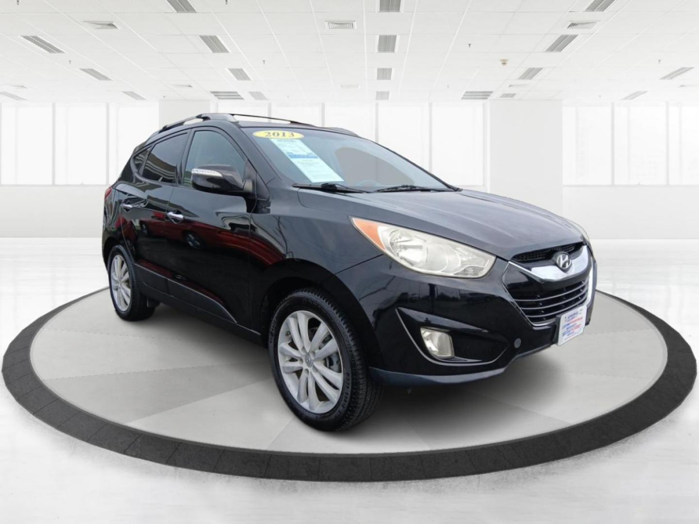 2013 Ash Black Mica Hyundai Tucson Limited 2WD (KM8JU3AC1DU) with an 2.4L L4 DOHC 16V engine, 6-Speed Automatic transmission, located at 1184 Kauffman Ave, Fairborn, OH, 45324, (937) 908-9800, 39.807072, -84.030914 - Photo#0