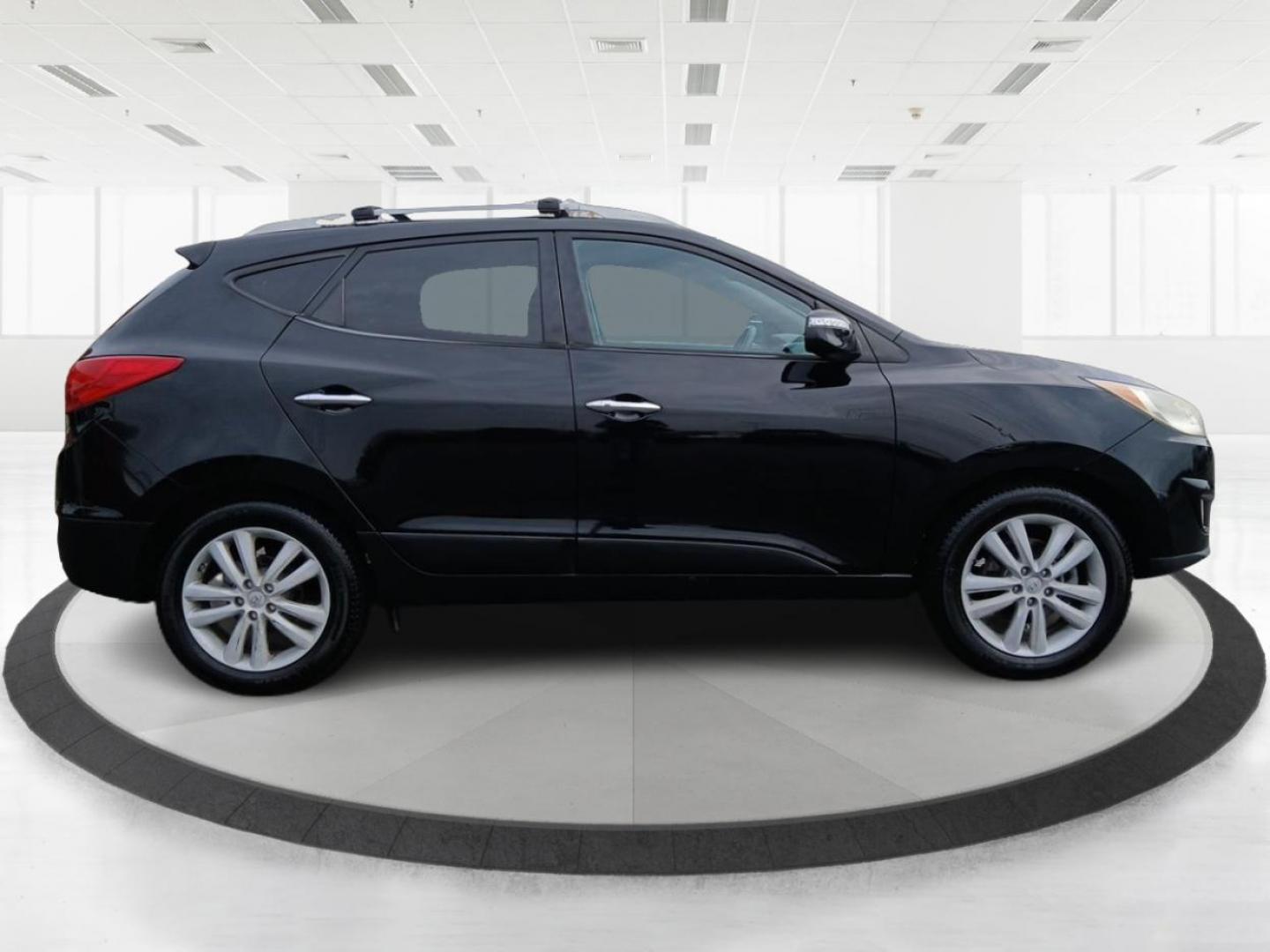 2013 Ash Black Mica Hyundai Tucson Limited 2WD (KM8JU3AC1DU) with an 2.4L L4 DOHC 16V engine, 6-Speed Automatic transmission, located at 1184 Kauffman Ave, Fairborn, OH, 45324, (937) 908-9800, 39.807072, -84.030914 - Photo#1