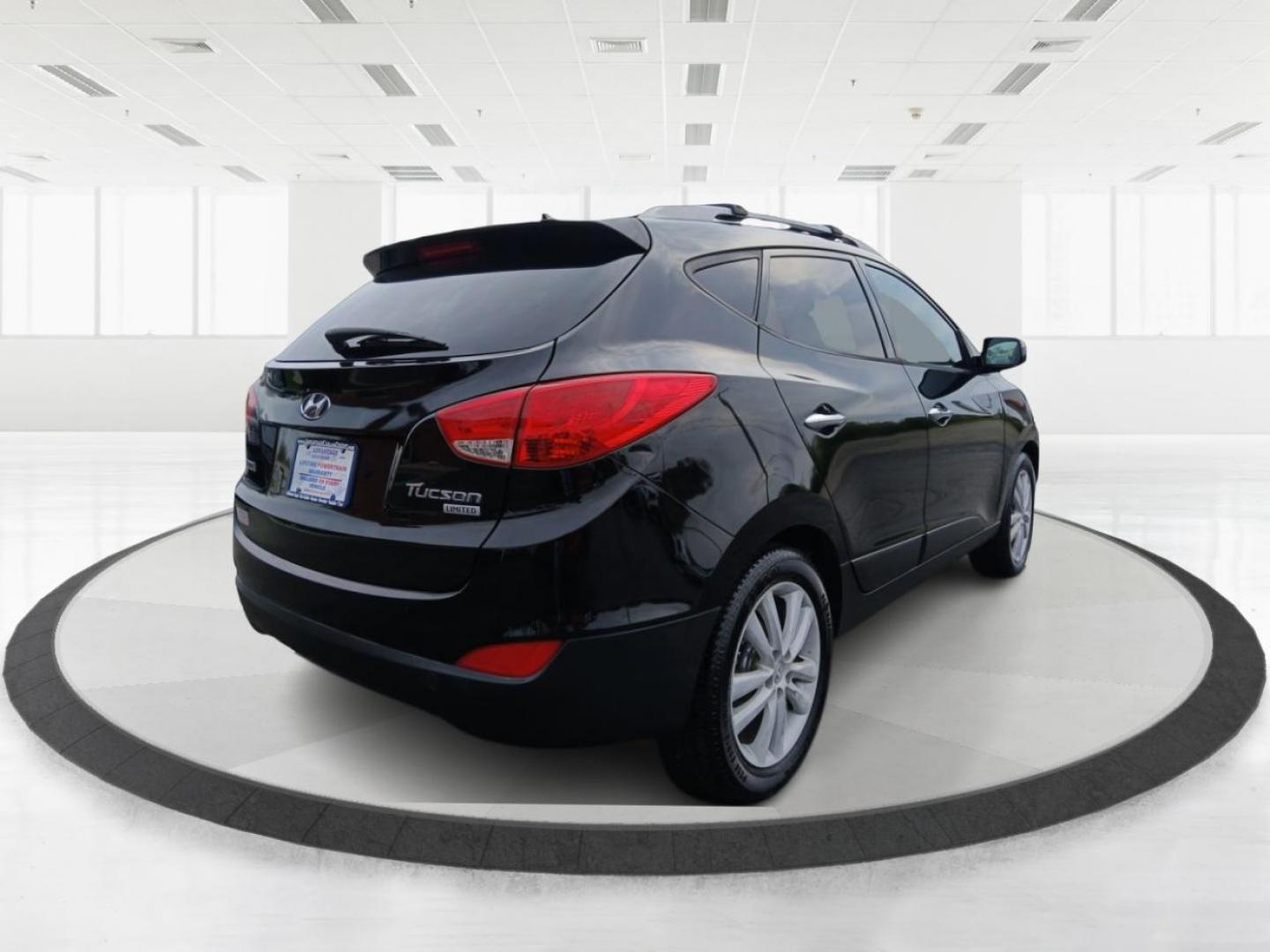 2013 Ash Black Mica Hyundai Tucson Limited 2WD (KM8JU3AC1DU) with an 2.4L L4 DOHC 16V engine, 6-Speed Automatic transmission, located at 1184 Kauffman Ave, Fairborn, OH, 45324, (937) 908-9800, 39.807072, -84.030914 - Photo#2