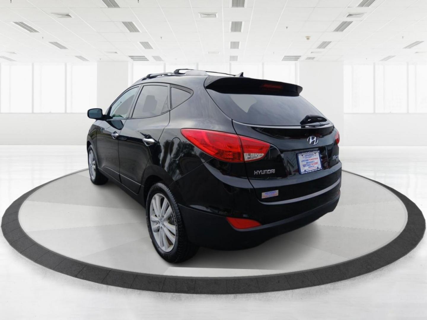 2013 Ash Black Mica Hyundai Tucson Limited 2WD (KM8JU3AC1DU) with an 2.4L L4 DOHC 16V engine, 6-Speed Automatic transmission, located at 1184 Kauffman Ave, Fairborn, OH, 45324, (937) 908-9800, 39.807072, -84.030914 - Photo#4