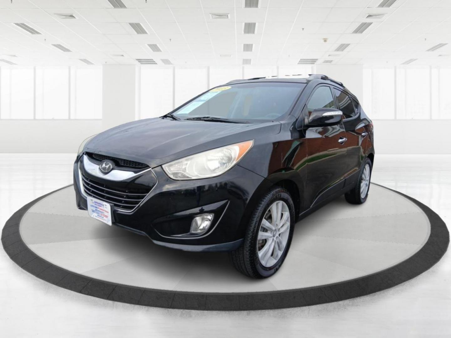 2013 Ash Black Mica Hyundai Tucson Limited 2WD (KM8JU3AC1DU) with an 2.4L L4 DOHC 16V engine, 6-Speed Automatic transmission, located at 1184 Kauffman Ave, Fairborn, OH, 45324, (937) 908-9800, 39.807072, -84.030914 - Photo#7