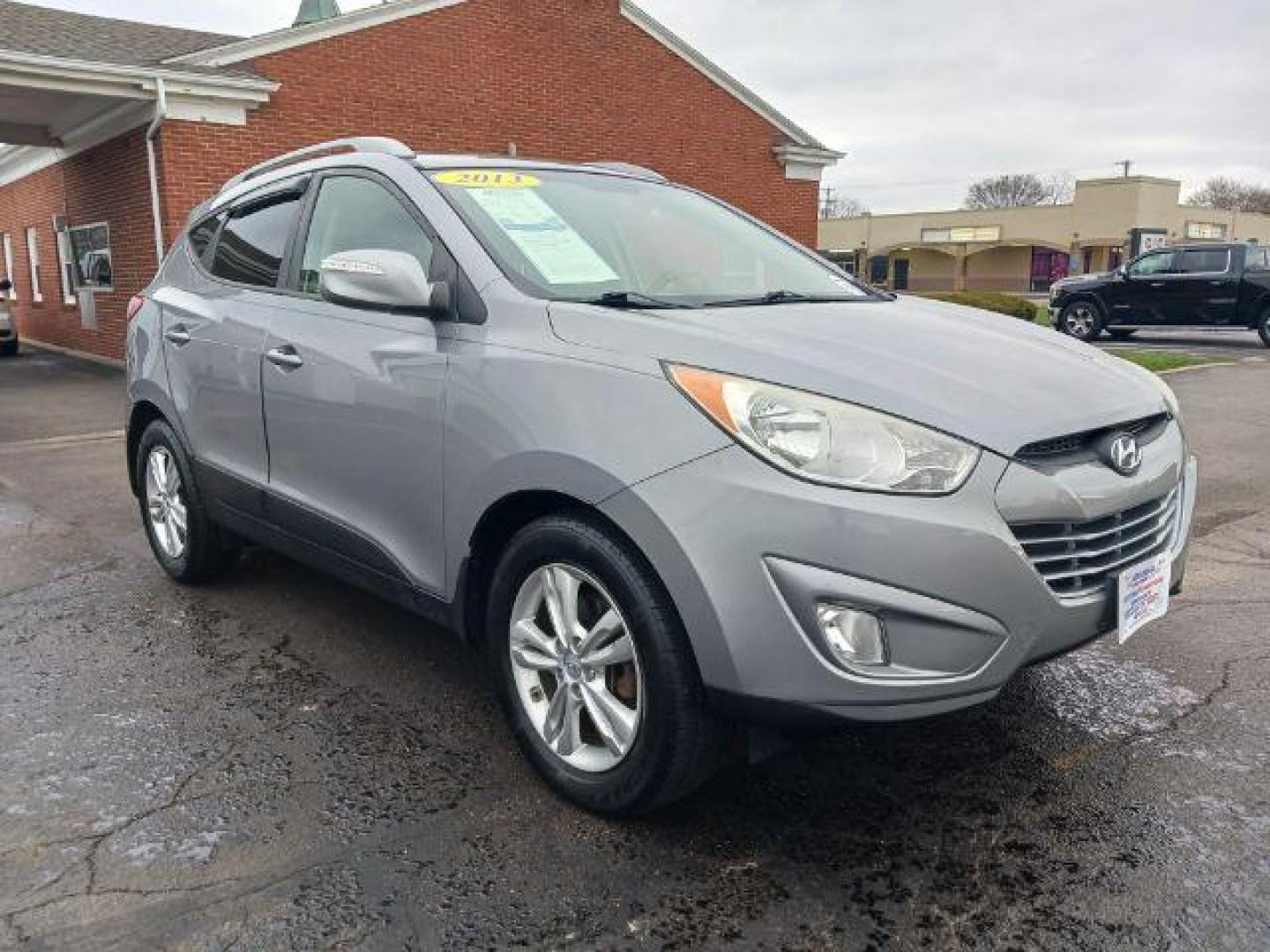 2013 Diamond Silver Metallic Hyundai Tucson GLS AWD (KM8JUCAC2DU) with an 2.4L L4 DOHC 16V engine, 6-Speed Automatic transmission, located at 401 Woodman Dr, Riverside, OH, 45431, (937) 908-9800, 39.760899, -84.123421 - Photo#0