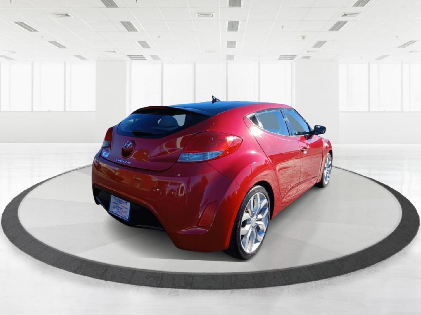 2013 Boston Red Metallic Hyundai Veloster Base (KMHTC6ADXDU) with an 1.6L L4 DOHC 16V engine, located at 401 Woodman Dr, Riverside, OH, 45431, (937) 908-9800, 39.760899, -84.123421 - Photo#2