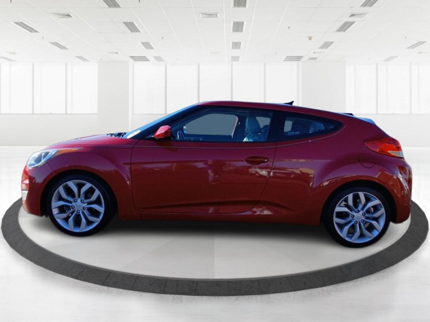 2013 Boston Red Metallic Hyundai Veloster Base (KMHTC6ADXDU) with an 1.6L L4 DOHC 16V engine, located at 401 Woodman Dr, Riverside, OH, 45431, (937) 908-9800, 39.760899, -84.123421 - Photo#5