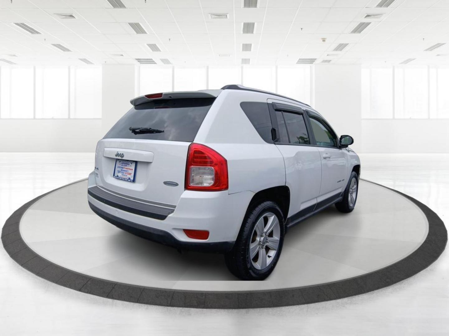 2013 Winter Chill Pearlcoat Jeep Compass Latitude 4WD (1C4NJDEB5DD) with an 2.4L L4 DOHC 16V engine, Continuously Variable Transmission transmission, located at 880 E. National Road, Vandalia, OH, 45377, (937) 908-9800, 39.891918, -84.183594 - Photo#2