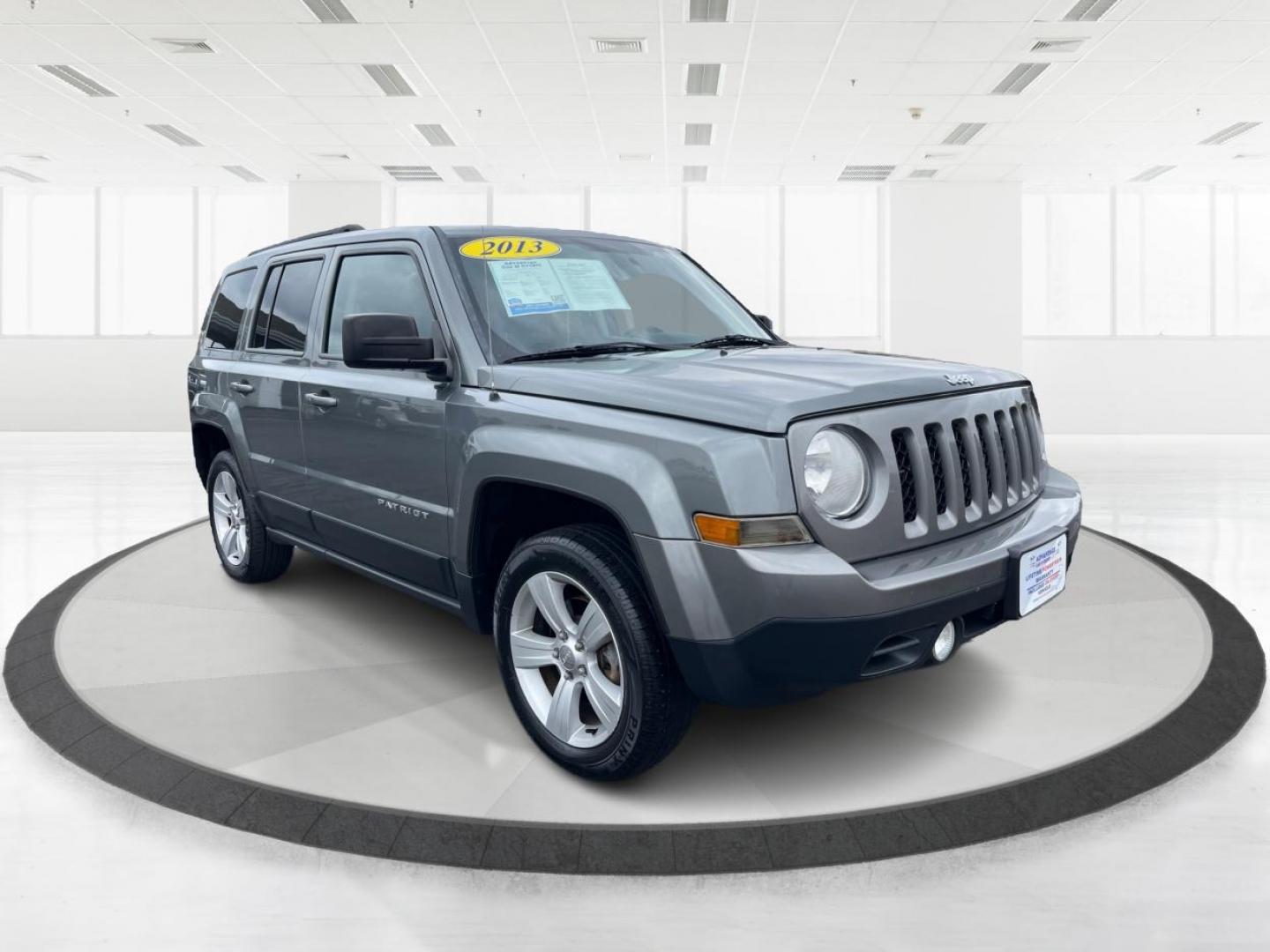 2013 Mineral Gray Metallic Jeep Patriot Latitude 4WD (1C4NJRFB5DD) with an 2.4L L4 DOHC 16V engine, located at 1951 S Dayton Lakeview Rd., New Carlisle, OH, 45344, (937) 908-9800, 39.890999, -84.050255 - Photo#0