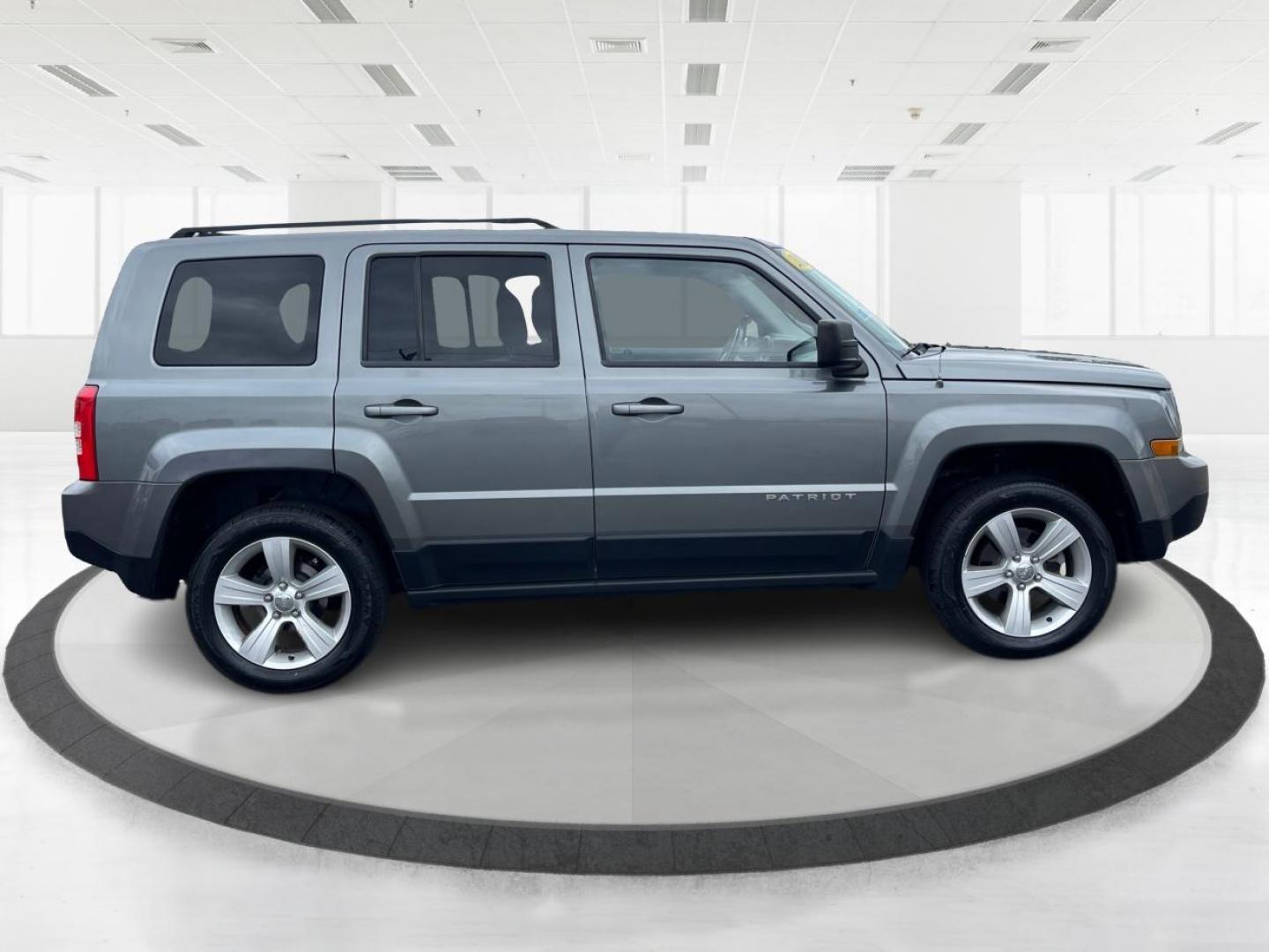 2013 Mineral Gray Metallic Jeep Patriot Latitude 4WD (1C4NJRFB5DD) with an 2.4L L4 DOHC 16V engine, located at 1951 S Dayton Lakeview Rd., New Carlisle, OH, 45344, (937) 908-9800, 39.890999, -84.050255 - Photo#1