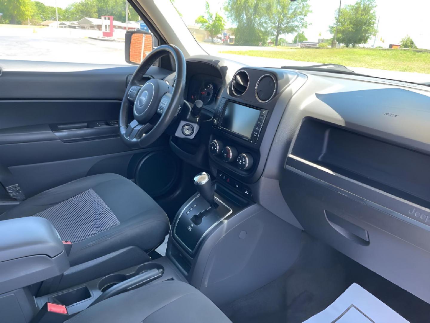 2013 Bright Silver Metallic Jeep Patriot Latitude 2WD (1C4NJPFBXDD) with an 2.4L L4 DOHC 16V engine, located at 1951 S Dayton Lakeview Rd., New Carlisle, OH, 45344, (937) 908-9800, 39.890999, -84.050255 - 2013 Jeep Patriot Latitude 2WD - Photo#8