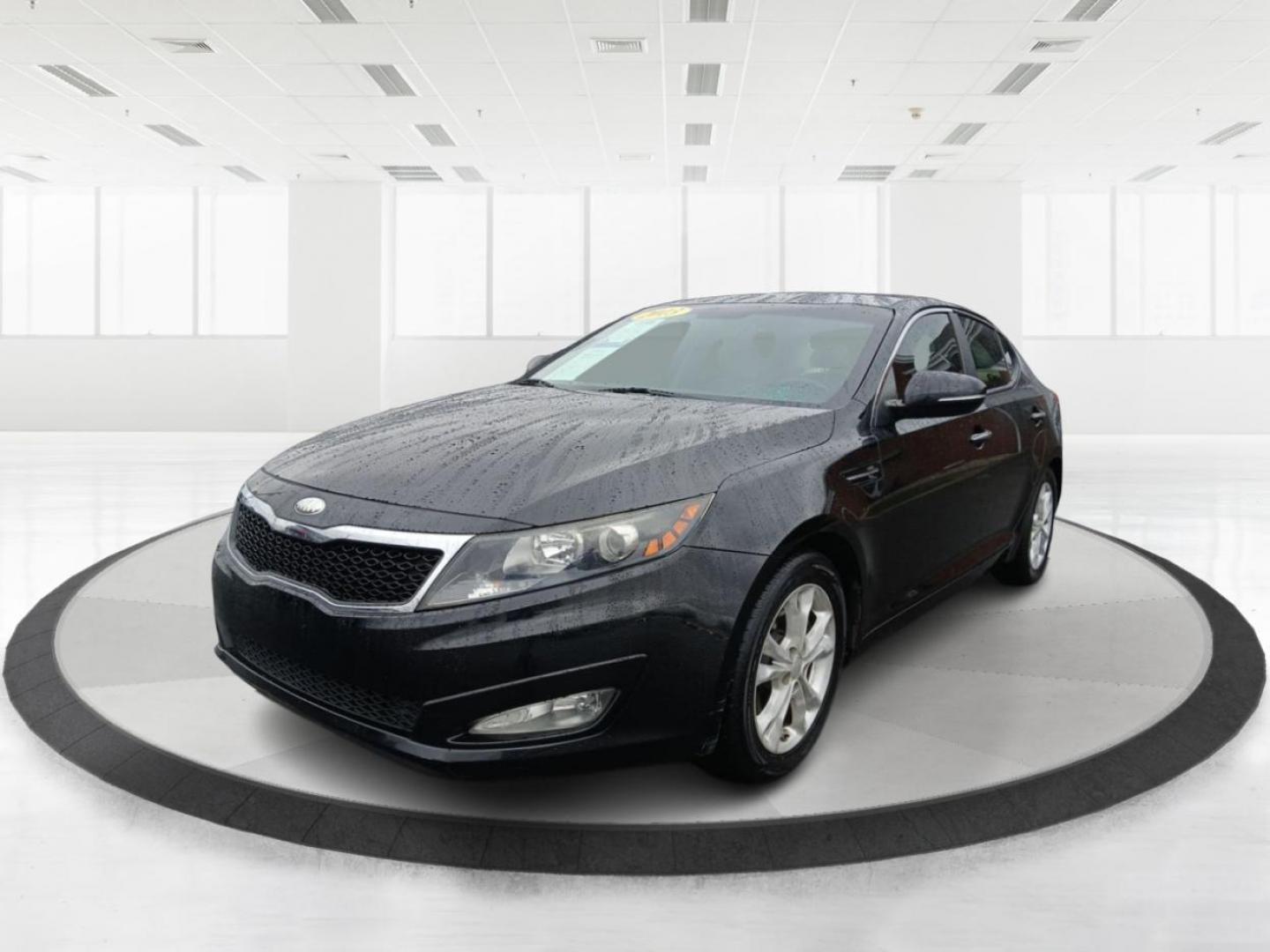 2013 Ebony Black Kia Optima EX (5XXGN4A77DG) with an 2.4L L4 DOHC 16V engine, 6-Speed Automatic transmission, located at 401 Woodman Dr, Riverside, OH, 45431, (937) 908-9800, 39.760899, -84.123421 - 2013 Kia Optima EX - Photo#7