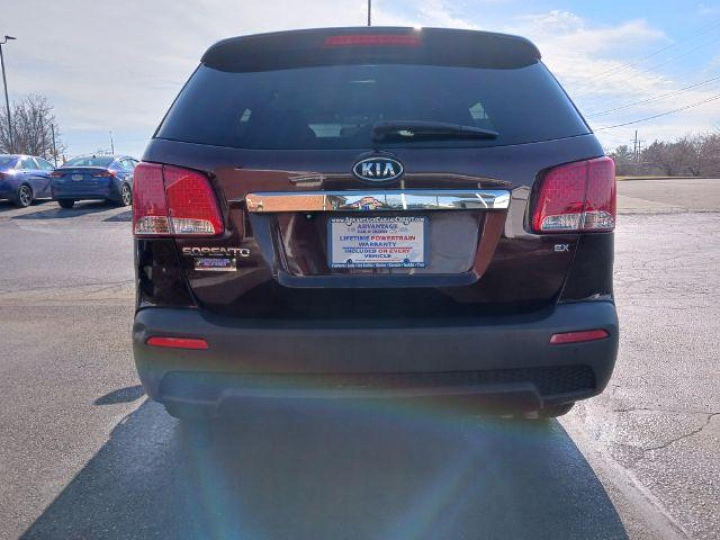 2013 Dark Cherry Kia Sorento EX 4WD (5XYKUCA67DG) with an 2.4L L4 DOHC 16V engine, 6-Speed Automatic transmission, located at 1184 Kauffman Ave, Fairborn, OH, 45324, (937) 908-9800, 39.807072, -84.030914 - Photo#5