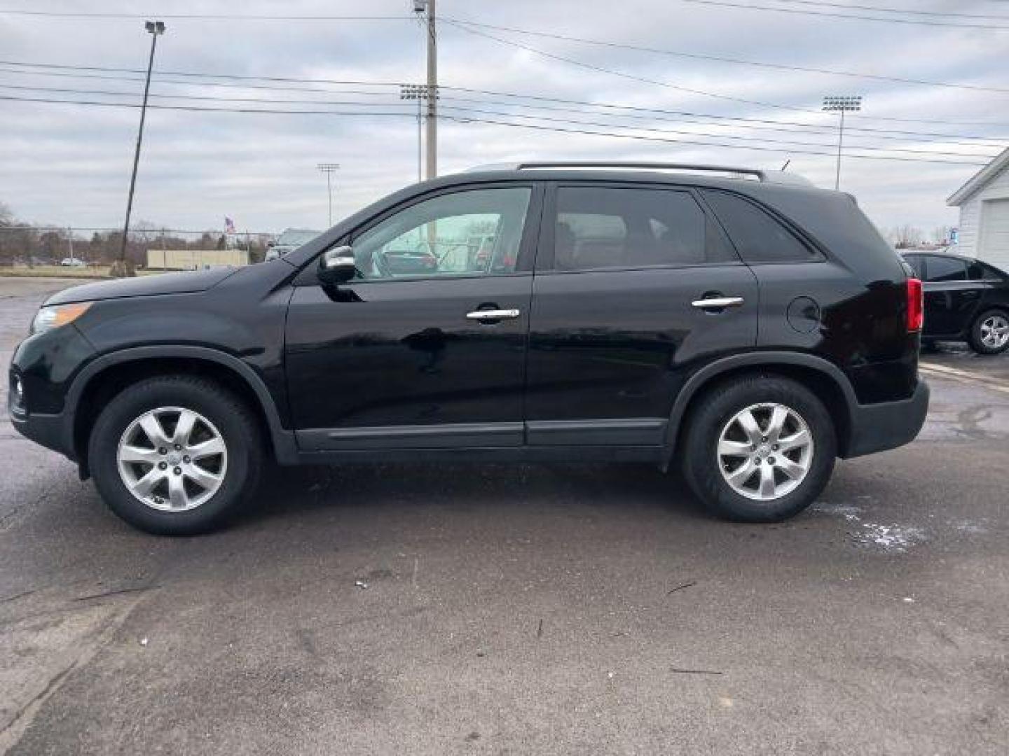 2013 Ebony Black Kia Sorento LX 2WD (5XYKT3A68DG) with an 2.4L L4 DOHC 16V engine, 6-Speed Automatic transmission, located at 401 Woodman Dr, Riverside, OH, 45431, (937) 908-9800, 39.760899, -84.123421 - Photo#3