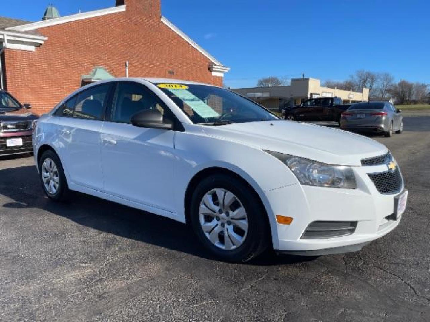 2014 Summit White Chevrolet Cruze LS Auto (1G1PA5SG7E7) with an 1.8L L4 DOHC 16V engine, 6-Speed Automatic transmission, located at 1099 N County Rd 25A , Troy, OH, 45373, (937) 908-9800, 40.057079, -84.212883 - Photo#0