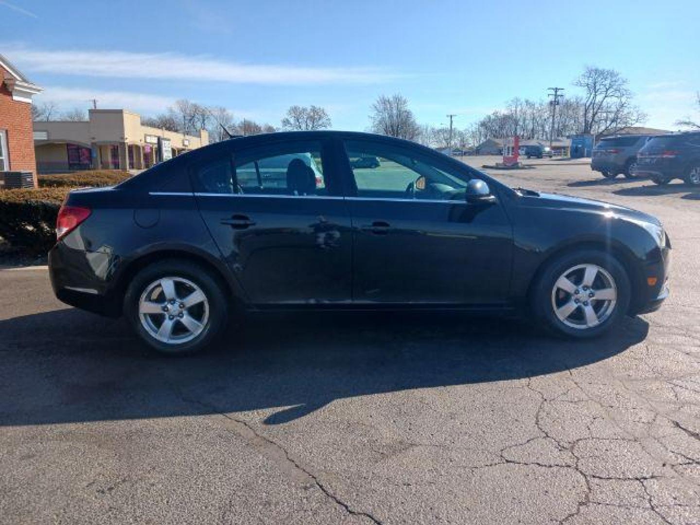 2014 Black Granite Metallic Chevrolet Cruze 1LT Auto (1G1PC5SB2E7) with an 1.4L L4 DOHC 16V TURBO engine, 6-Speed Automatic transmission, located at 4508 South Dixie Dr, Moraine, OH, 45439, (937) 908-9800, 39.689976, -84.218452 - Photo#4