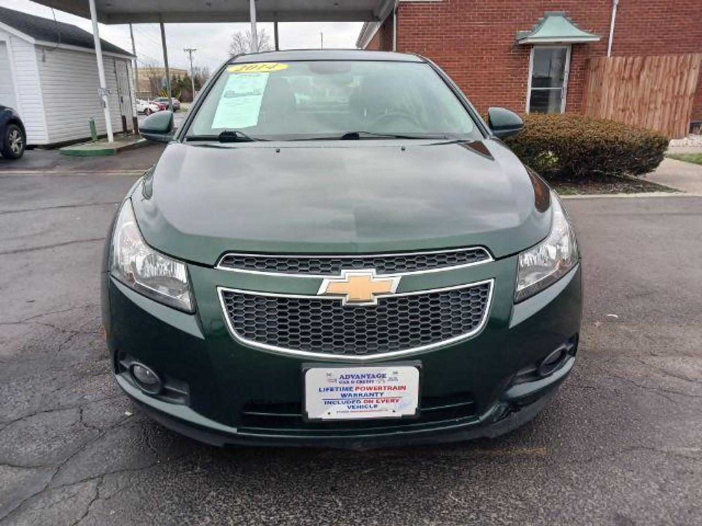 2014 Rainforest Green Metallic Chevrolet Cruze LTZ Auto (1G1PG5SB9E7) with an 1.4L L4 DOHC 16V TURBO engine, 6-Speed Automatic transmission, located at 1099 N County Rd 25A , Troy, OH, 45373, (937) 908-9800, 40.057079, -84.212883 - Photo#1