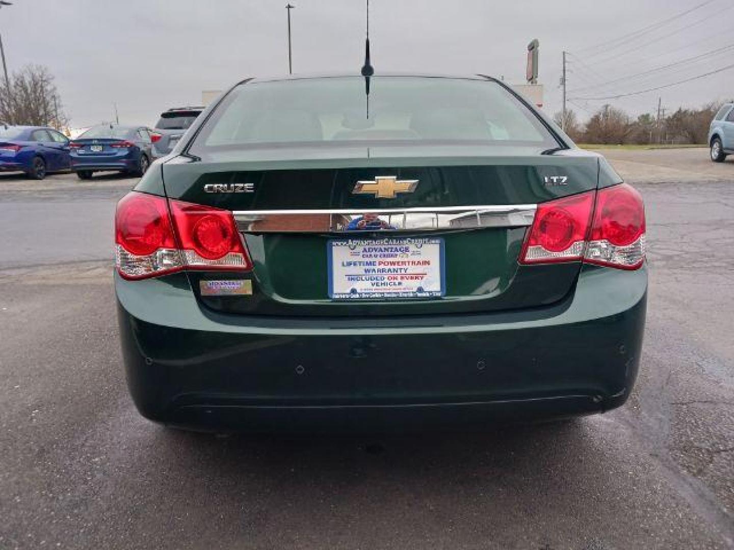 2014 Rainforest Green Metallic Chevrolet Cruze LTZ Auto (1G1PG5SB9E7) with an 1.4L L4 DOHC 16V TURBO engine, 6-Speed Automatic transmission, located at 1099 N County Rd 25A , Troy, OH, 45373, (937) 908-9800, 40.057079, -84.212883 - Photo#5