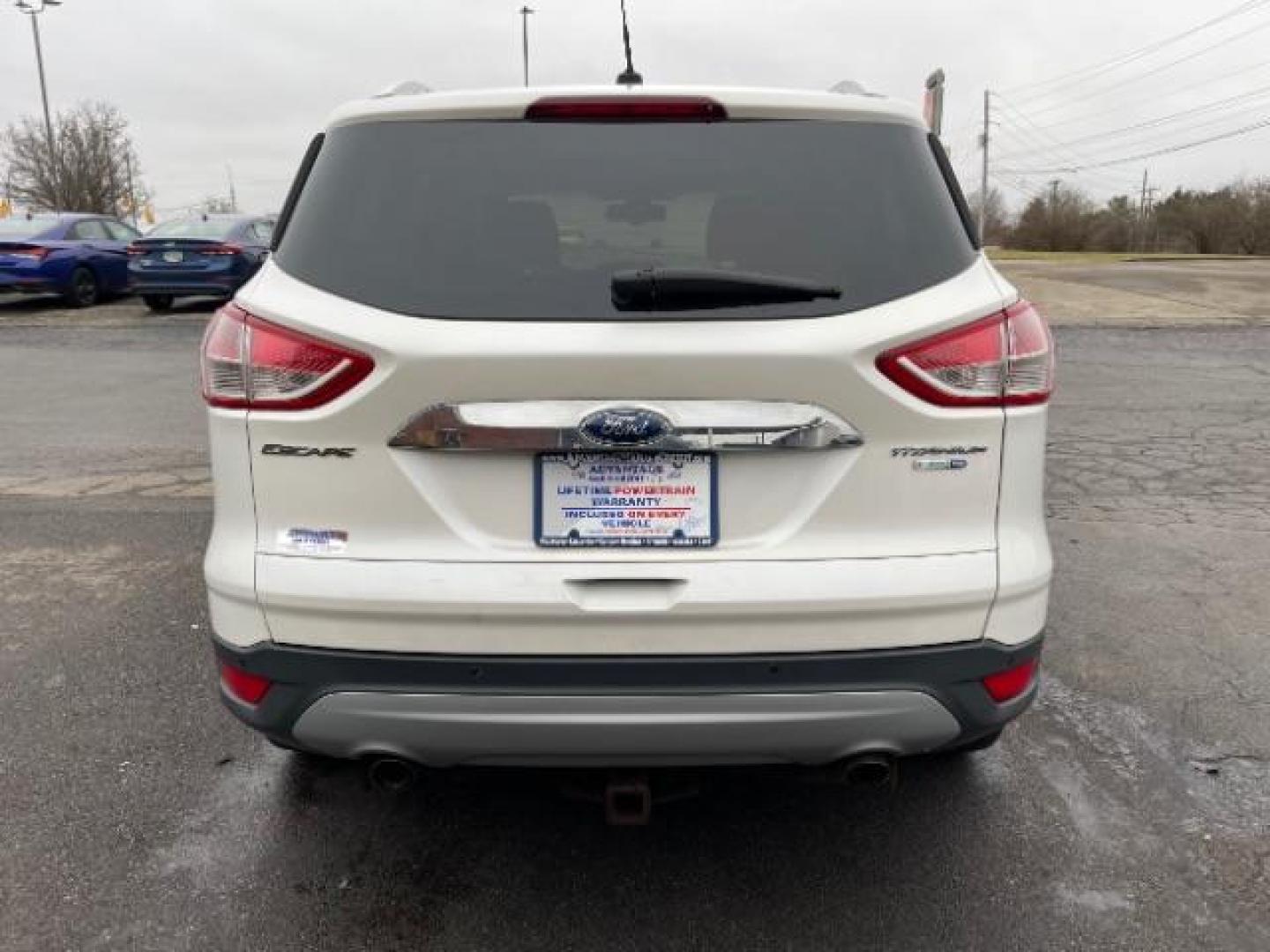 2014 White Platinum Tricoat Ford Escape Titanium 4WD (1FMCU9J95EU) with an 2.0L L4 DOHC 16V engine, 6-Speed Automatic transmission, located at 1184 Kauffman Ave, Fairborn, OH, 45324, (937) 908-9800, 39.807072, -84.030914 - Photo#2