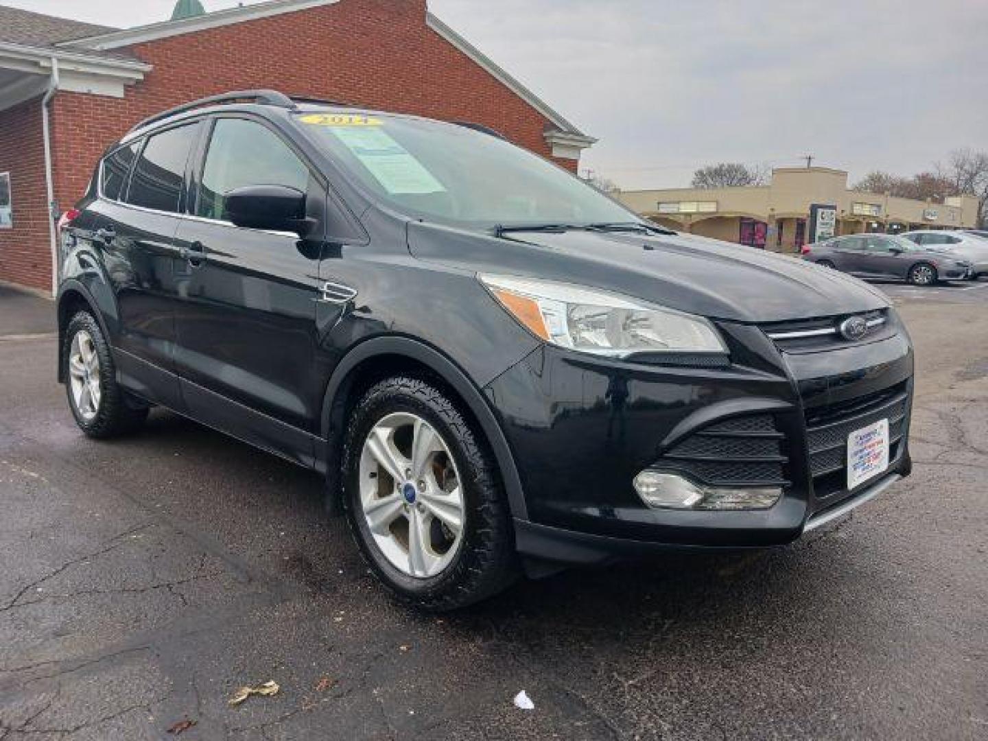 2014 Tuxedo Black Ford Escape SE 4WD (1FMCU9G99EU) with an 2.0L L4 DOHC 16V engine, 6-Speed Automatic transmission, located at 4508 South Dixie Dr, Moraine, OH, 45439, (937) 908-9800, 39.689976, -84.218452 - Photo#0