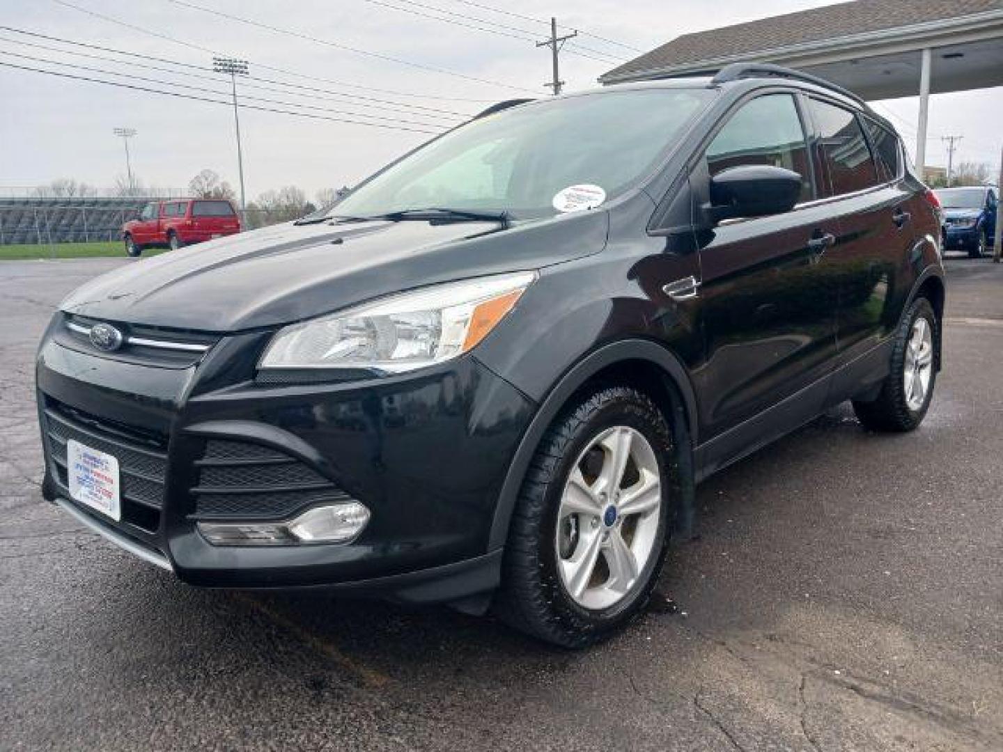 2014 Tuxedo Black Ford Escape SE 4WD (1FMCU9G99EU) with an 2.0L L4 DOHC 16V engine, 6-Speed Automatic transmission, located at 4508 South Dixie Dr, Moraine, OH, 45439, (937) 908-9800, 39.689976, -84.218452 - Photo#2