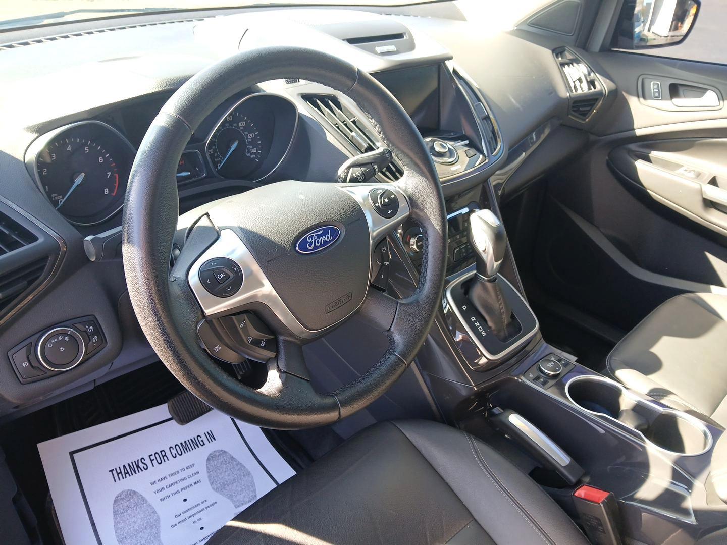 2014 Tuxedo Black Ford Escape Titanium 4WD (1FMCU9J97EU) with an 2.0L L4 DOHC 16V engine, 6-Speed Automatic transmission, located at 8750 N County Rd 25A, Piqua, OH, 45356, (937) 908-9800, 40.164391, -84.232513 - Photo#8