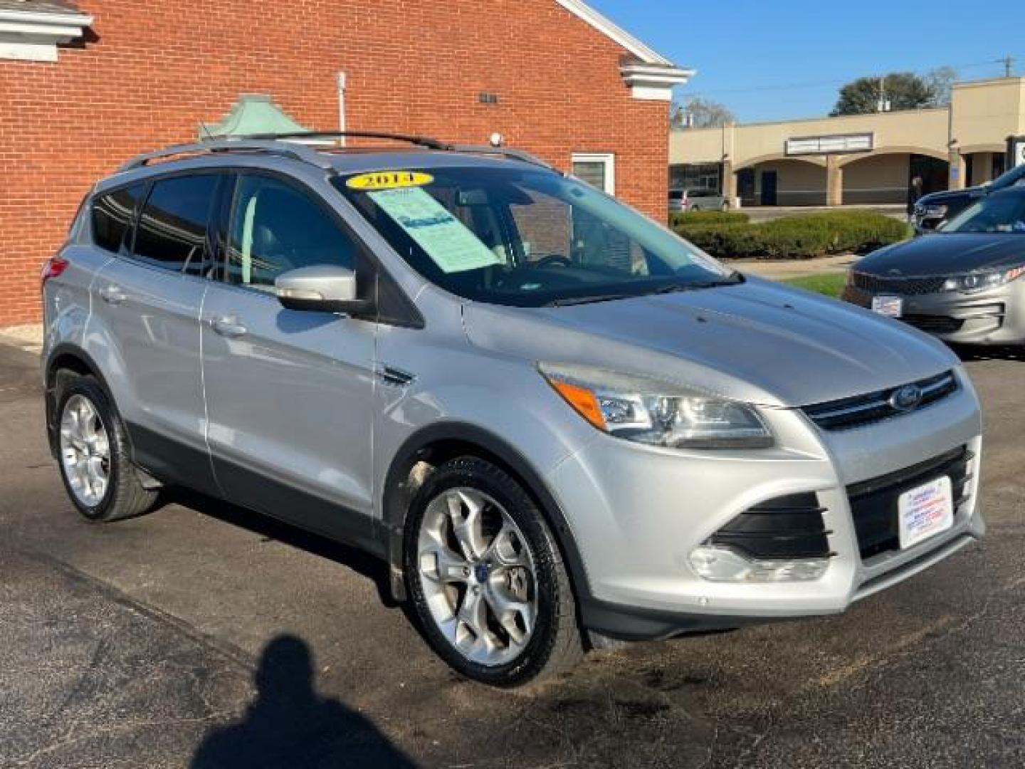 2014 Sterling Gray Metallic Ford Escape Titanium 4WD (1FMCU9J96EU) with an 2.0L L4 DOHC 16V engine, 6-Speed Automatic transmission, located at 1184 Kauffman Ave, Fairborn, OH, 45324, (937) 908-9800, 39.807072, -84.030914 - Photo#0