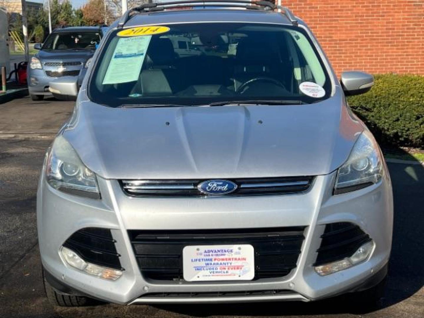 2014 Sterling Gray Metallic Ford Escape Titanium 4WD (1FMCU9J96EU) with an 2.0L L4 DOHC 16V engine, 6-Speed Automatic transmission, located at 1184 Kauffman Ave, Fairborn, OH, 45324, (937) 908-9800, 39.807072, -84.030914 - Photo#1