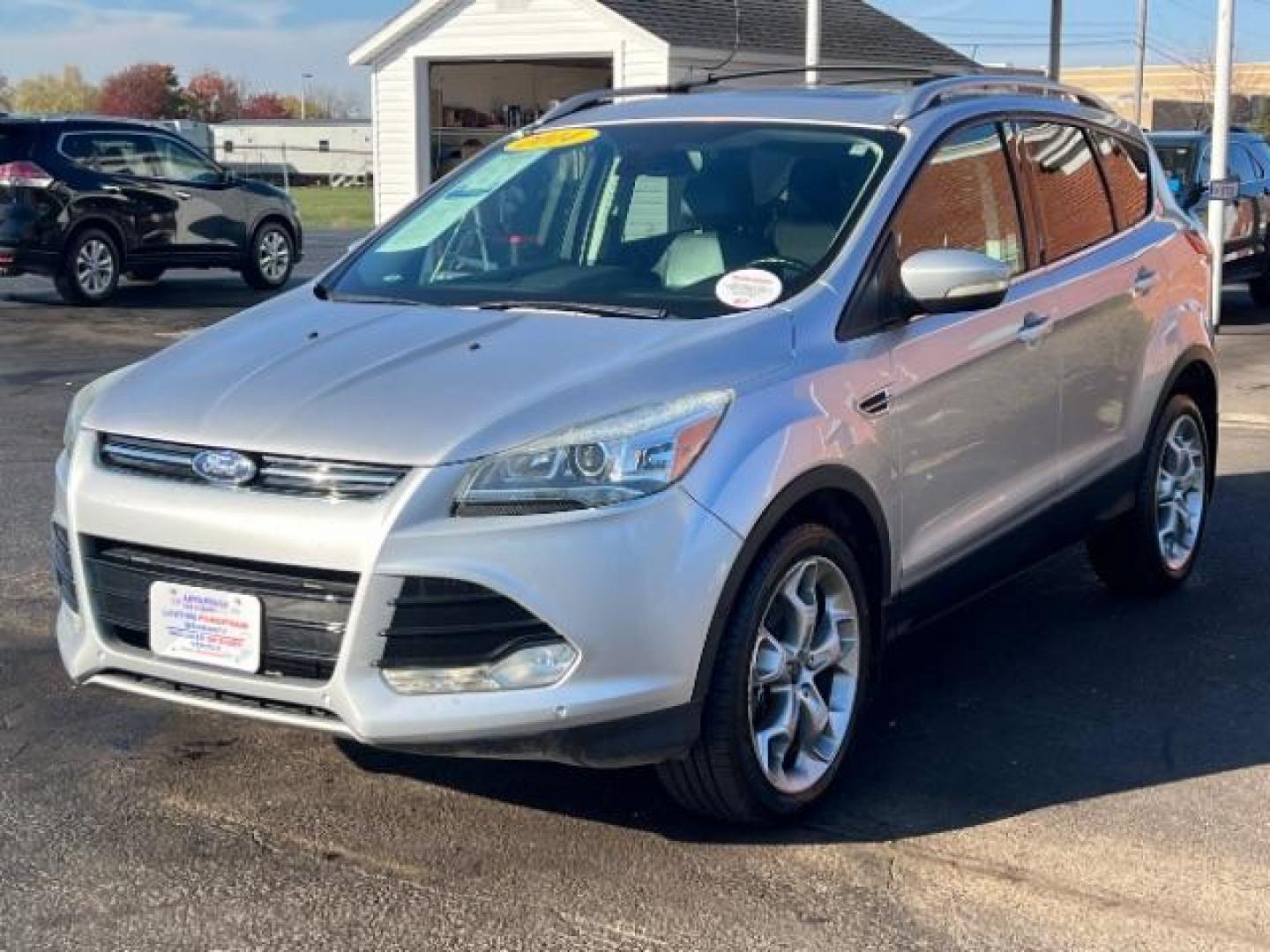 2014 Sterling Gray Metallic Ford Escape Titanium 4WD (1FMCU9J96EU) with an 2.0L L4 DOHC 16V engine, 6-Speed Automatic transmission, located at 1184 Kauffman Ave, Fairborn, OH, 45324, (937) 908-9800, 39.807072, -84.030914 - Photo#2