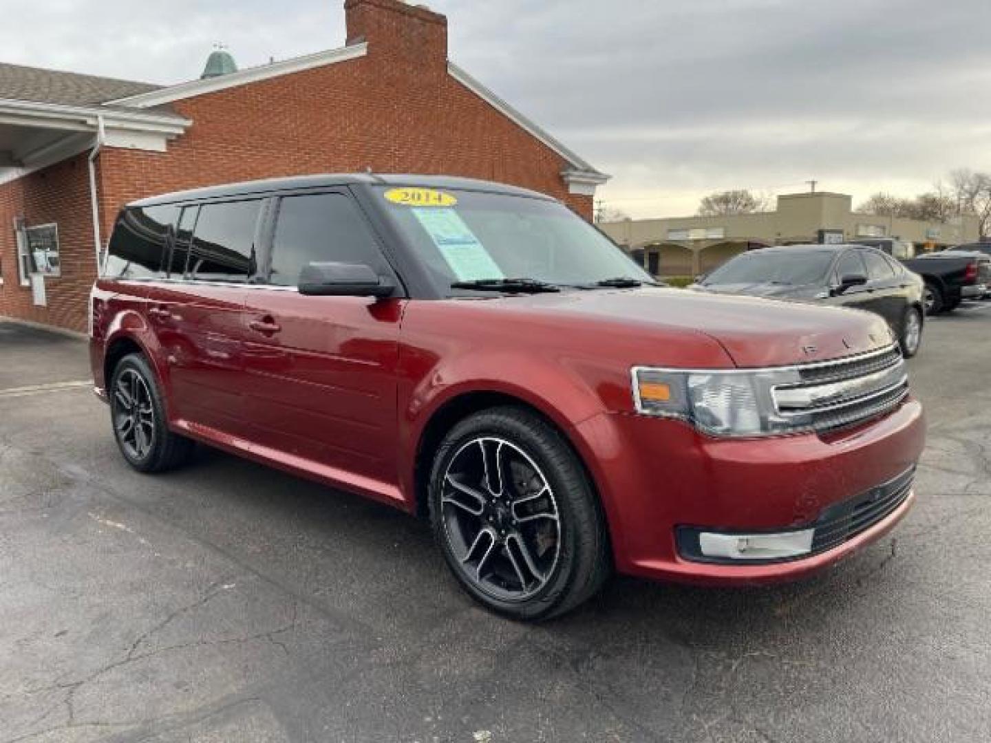 2014 Orange Ford Flex SEL FWD (2FMGK5C89EB) with an 3.5L V6 DOHC 24V engine, 6-Speed Automatic Overdrive transmission, located at 401 Woodman Dr, Riverside, OH, 45431, (937) 908-9800, 39.760899, -84.123421 - Photo#0