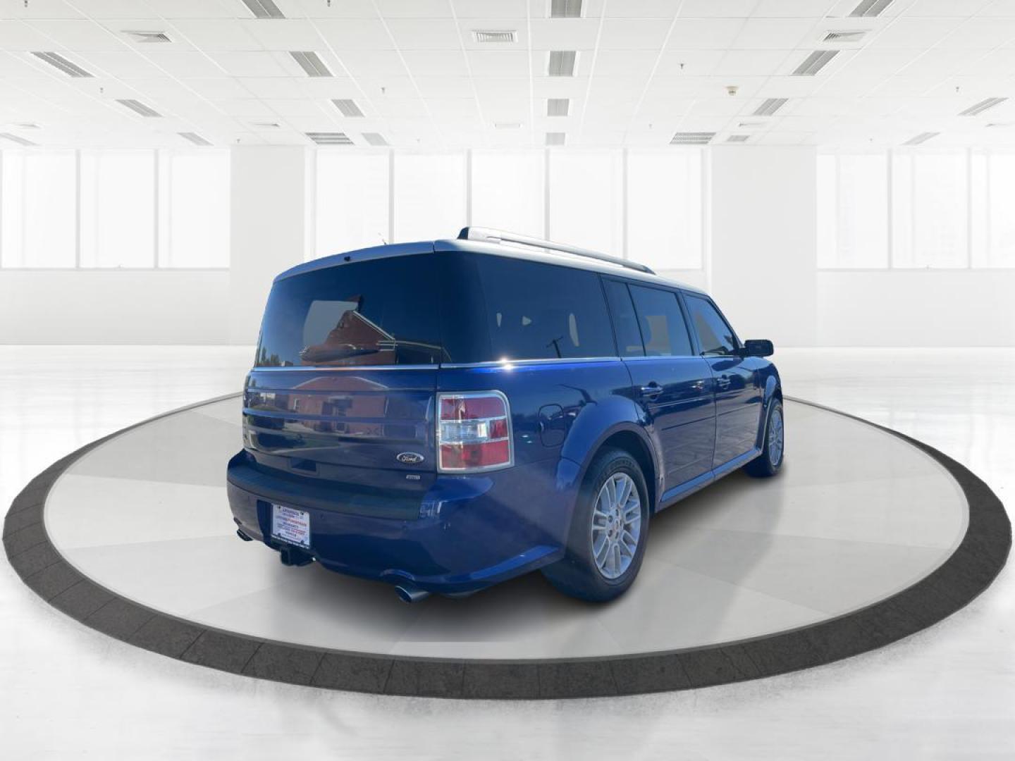 2014 Deep Impact Blue Metallic Ford Flex SEL AWD (2FMHK6C89EB) with an 3.5L V6 DOHC 24V engine, 6-Speed Automatic Overdrive transmission, located at 1099 N County Rd 25A , Troy, OH, 45373, (937) 908-9800, 40.057079, -84.212883 - Photo#2