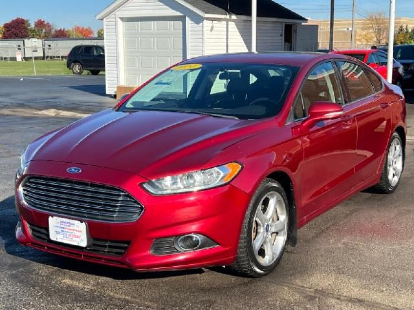 2014 Ruby Red Met Tinted CC Ford Fusion SE (3FA6P0H77ER) with an 2.5L L4 DOHC 16V engine, located at 1184 Kauffman Ave, Fairborn, OH, 45324, (937) 908-9800, 39.807072, -84.030914 - Photo#2