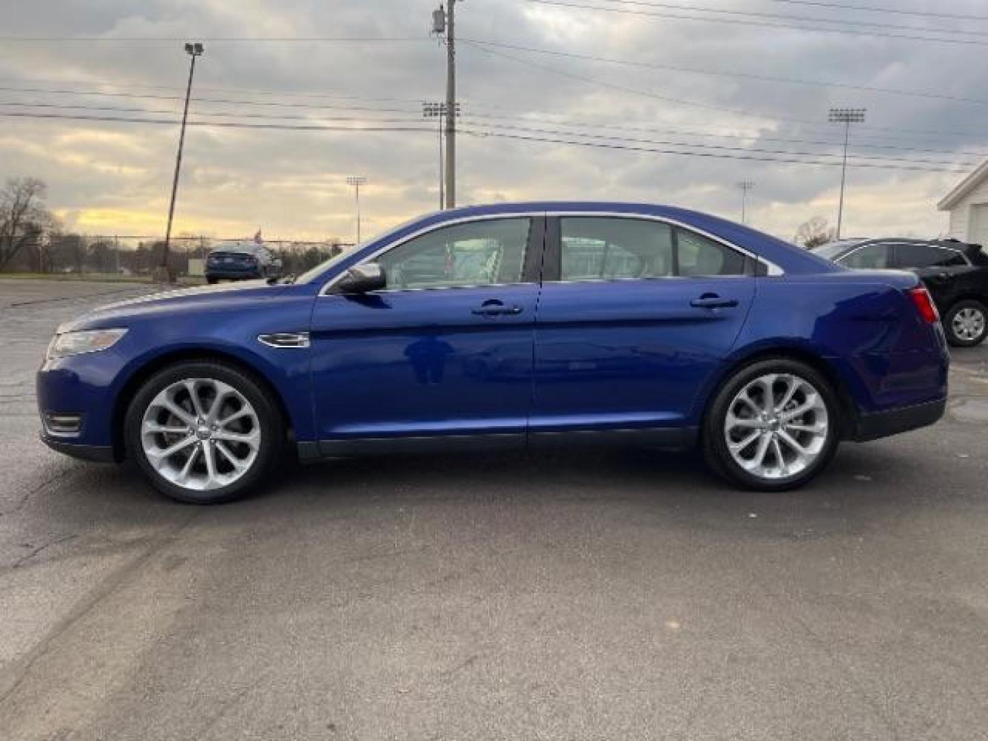 2014 Deep Impact Blue Metallic Ford Taurus Limited AWD (1FAHP2J86EG) with an 3.5L V6 DOHC 24V engine, 6-Speed Automatic transmission, located at 1230 East Main St, Xenia, OH, 45385, (937) 908-9800, 39.688026, -83.910172 - Photo#5