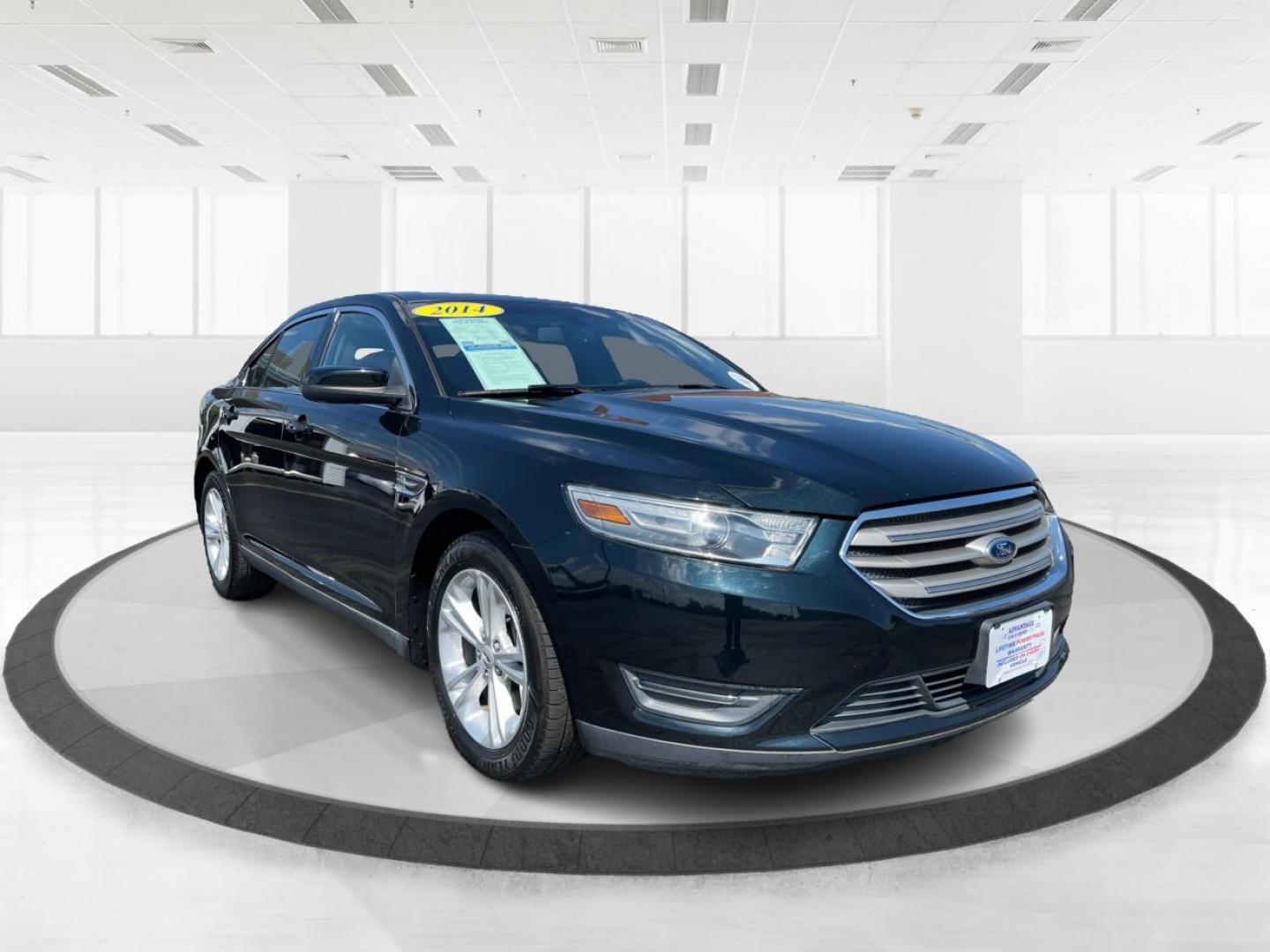 2014 Sterling Gray Metallic Ford Taurus (1FAHP2E80EG) with an 3.5L V6 DOHC 24V engine, 6-Speed Automatic transmission, located at 1230 East Main St, Xenia, OH, 45385, (937) 908-9800, 39.688026, -83.910172 - Photo#0