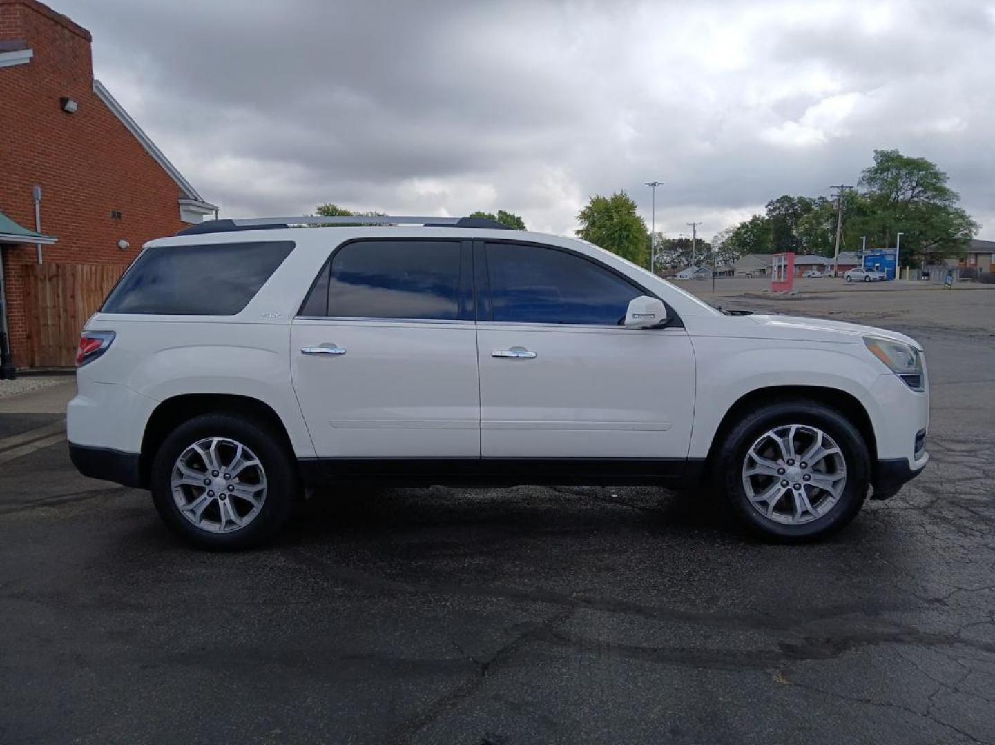 2014 Summit White GMC Acadia SLT-1 AWD (1GKKVRKD8EJ) with an 3.6L V6 DOHC 24V engine, 6-Speed Automatic transmission, located at 1951 S Dayton Lakeview Rd., New Carlisle, OH, 45344, (937) 908-9800, 39.890999, -84.050255 - Photo#0