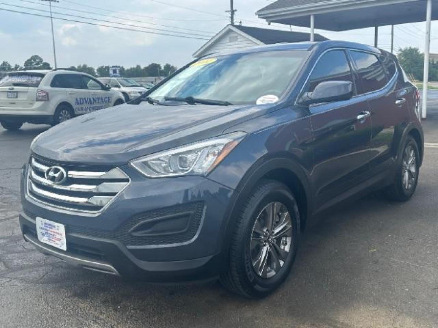 2014 Marlin Blue Hyundai Santa Fe Sport 2.4 FWD (5XYZT3LB3EG) with an 2.4L L4 DOHC 16V engine, 6-Speed Automatic transmission, located at 1230 East Main St, Xenia, OH, 45385, (937) 908-9800, 39.688026, -83.910172 - Photo#2