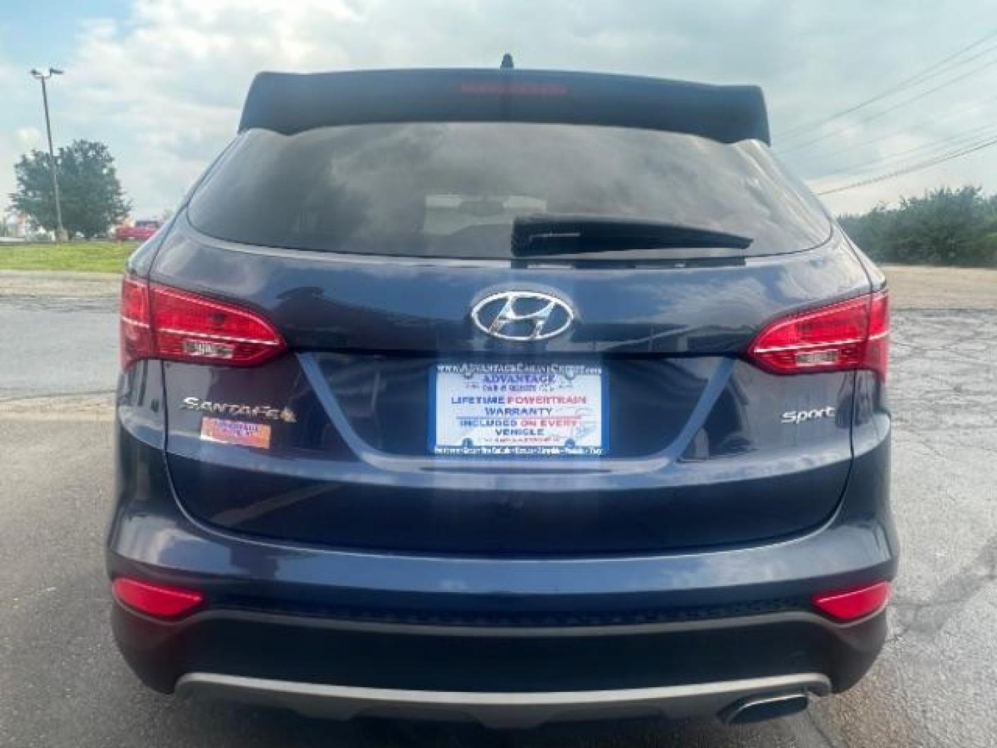 2014 Marlin Blue Hyundai Santa Fe Sport 2.4 FWD (5XYZT3LB3EG) with an 2.4L L4 DOHC 16V engine, 6-Speed Automatic transmission, located at 1230 East Main St, Xenia, OH, 45385, (937) 908-9800, 39.688026, -83.910172 - Photo#4