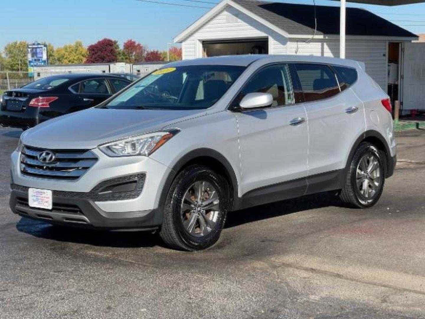 2014 Moonstone Silver Hyundai Santa Fe Sport 2.4 AWD (5XYZTDLB2EG) with an 2.4L L4 DOHC 16V engine, 6-Speed Automatic transmission, located at 1099 N County Rd 25A , Troy, OH, 45373, (937) 908-9800, 40.057079, -84.212883 - Photo#2