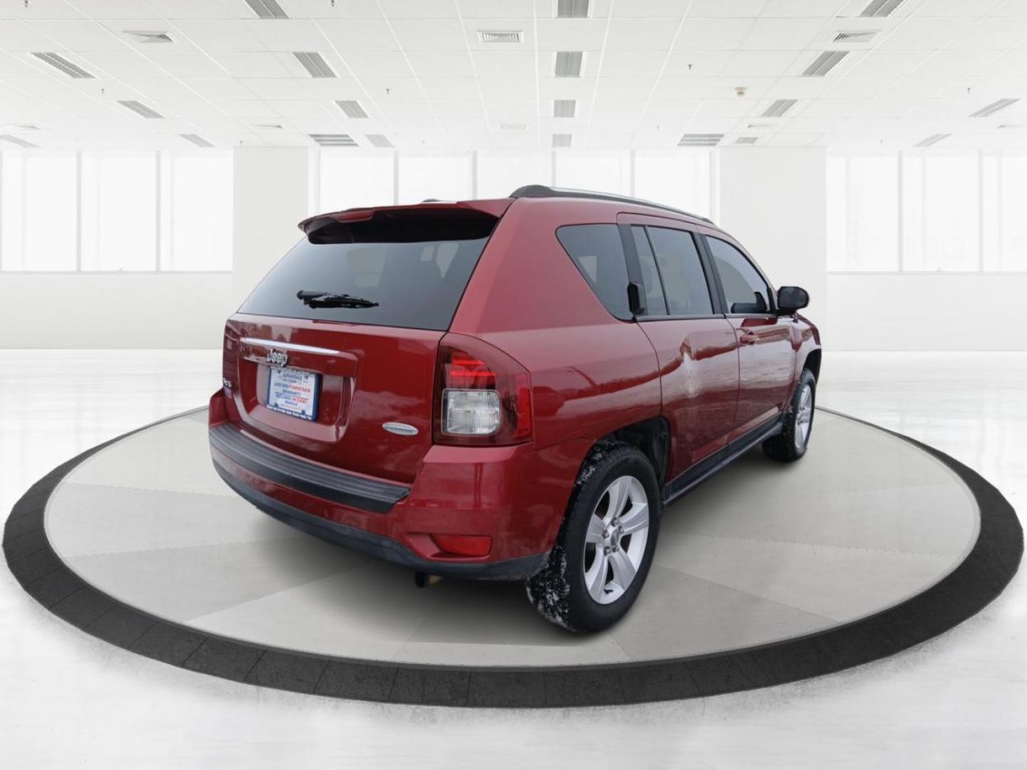 2014 Dp Cherry Red Crystal PC Jeep Compass Latitude 4WD (1C4NJDEB4ED) with an 2.4L L4 DOHC 16V engine, Continuously Variable Transmission transmission, located at 8750 N County Rd 25A, Piqua, OH, 45356, (937) 908-9800, 40.164391, -84.232513 - 2014 Jeep Compass Latitude 4WD - Photo#2