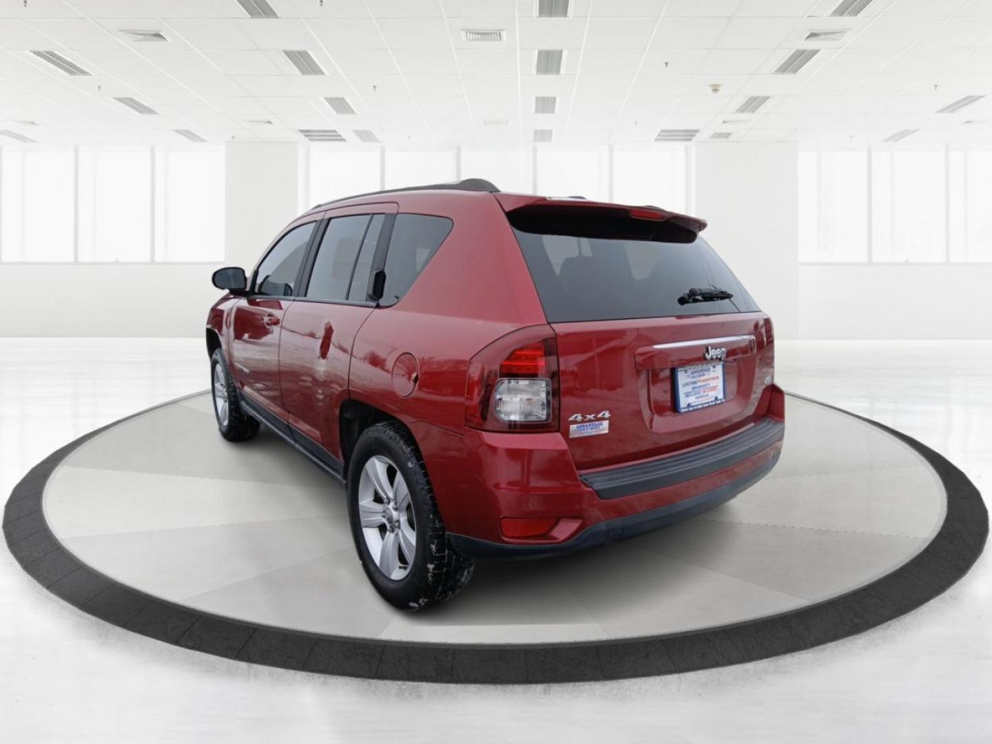 2014 Dp Cherry Red Crystal PC Jeep Compass Latitude 4WD (1C4NJDEB4ED) with an 2.4L L4 DOHC 16V engine, Continuously Variable Transmission transmission, located at 8750 N County Rd 25A, Piqua, OH, 45356, (937) 908-9800, 40.164391, -84.232513 - 2014 Jeep Compass Latitude 4WD - Photo#4