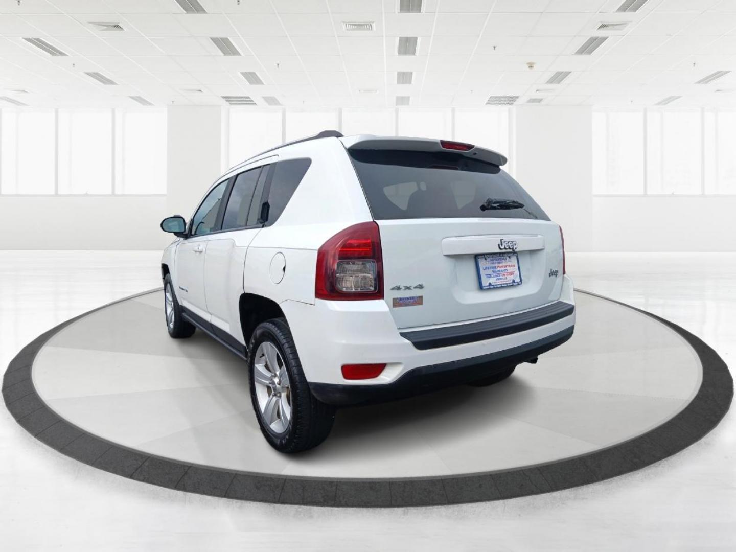 2014 Winter Chill Pearlcoat Jeep Compass (1C4NJDBB1ED) with an 2.4L L4 DOHC 16V engine, located at 880 E. National Road, Vandalia, OH, 45377, (937) 908-9800, 39.891918, -84.183594 - Photo#2