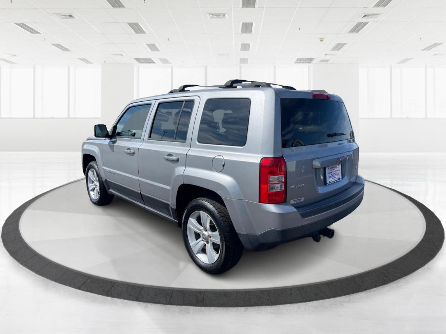 2014 Bright Silver Metallic CC Jeep Patriot Latitude 4WD (1C4NJRFB2ED) with an 2.4L L4 DOHC 16V engine, located at 1951 S Dayton Lakeview Rd., New Carlisle, OH, 45344, (937) 908-9800, 39.890999, -84.050255 - Photo#4