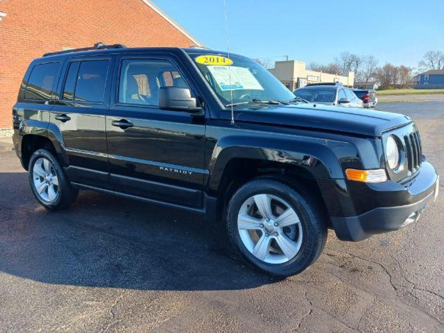 2014 Black Clearcoat Jeep Patriot Latitude 4WD (1C4NJRFB8ED) with an 2.4L L4 DOHC 16V engine, located at 401 Woodman Dr, Riverside, OH, 45431, (937) 908-9800, 39.760899, -84.123421 - Photo#0