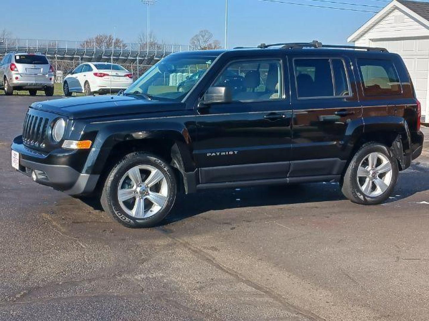 2014 Black Clearcoat Jeep Patriot Latitude 4WD (1C4NJRFB8ED) with an 2.4L L4 DOHC 16V engine, located at 401 Woodman Dr, Riverside, OH, 45431, (937) 908-9800, 39.760899, -84.123421 - Photo#2