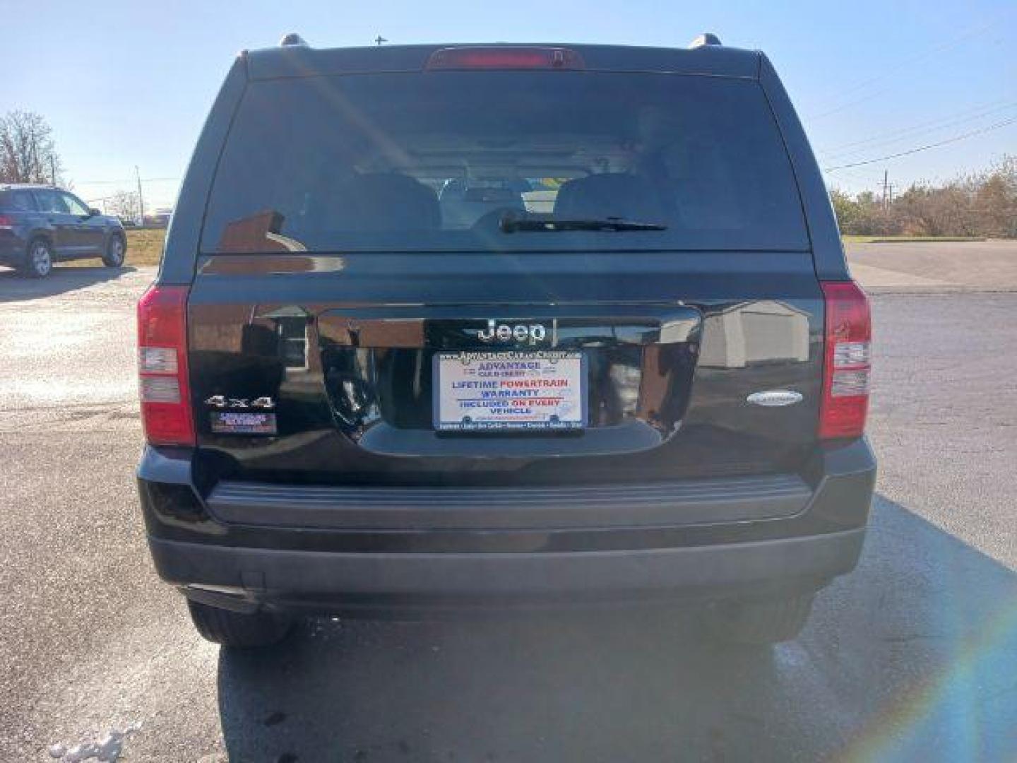 2014 Black Clearcoat Jeep Patriot Latitude 4WD (1C4NJRFB8ED) with an 2.4L L4 DOHC 16V engine, located at 401 Woodman Dr, Riverside, OH, 45431, (937) 908-9800, 39.760899, -84.123421 - Photo#5