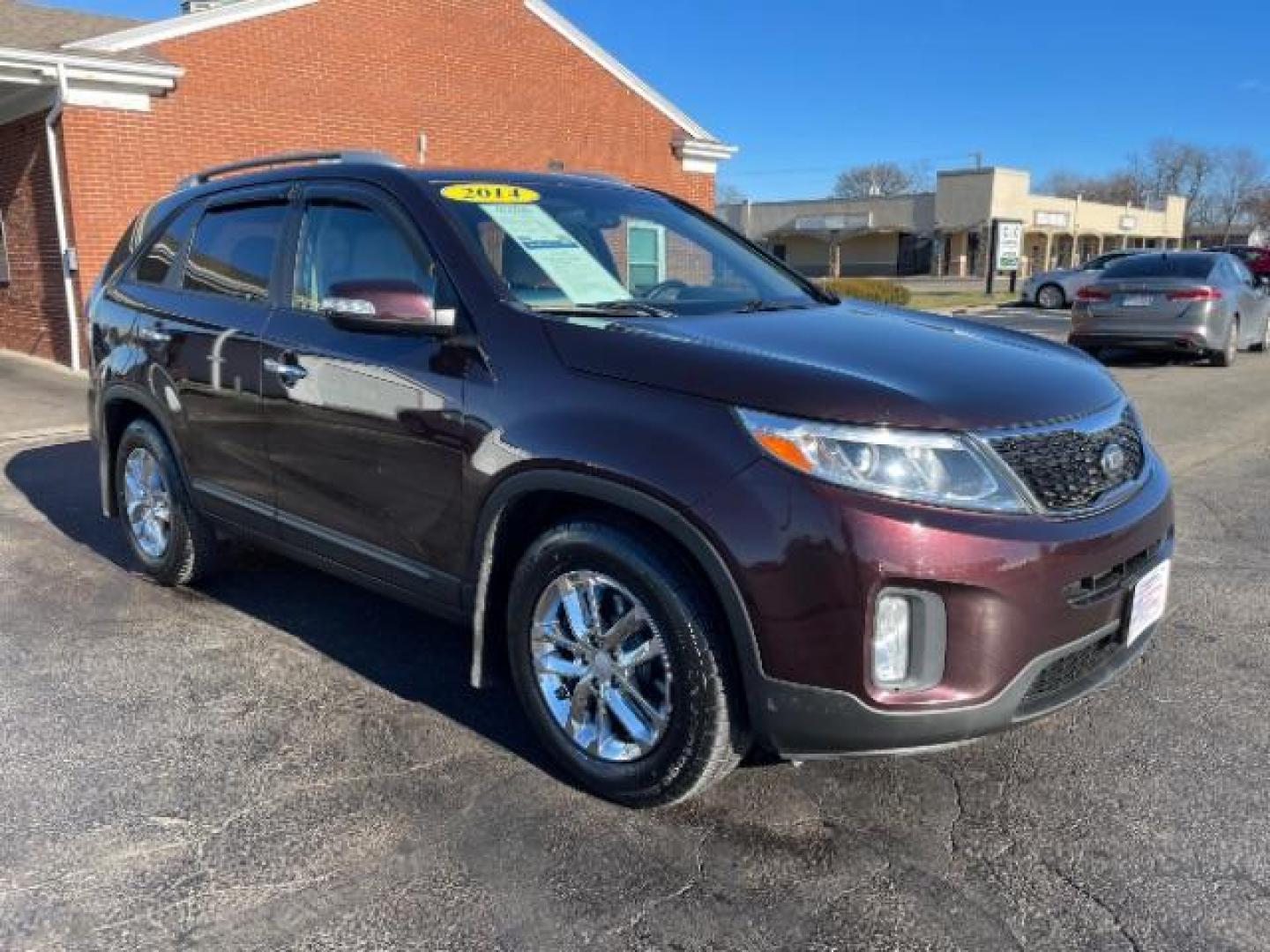 2014 Maroon Kia Sorento LX 2WD (5XYKT3A6XEG) with an 2.4L L4 DOHC 16V engine, 6-Speed Automatic transmission, located at 4508 South Dixie Dr, Moraine, OH, 45439, (937) 908-9800, 39.689976, -84.218452 - Photo#0