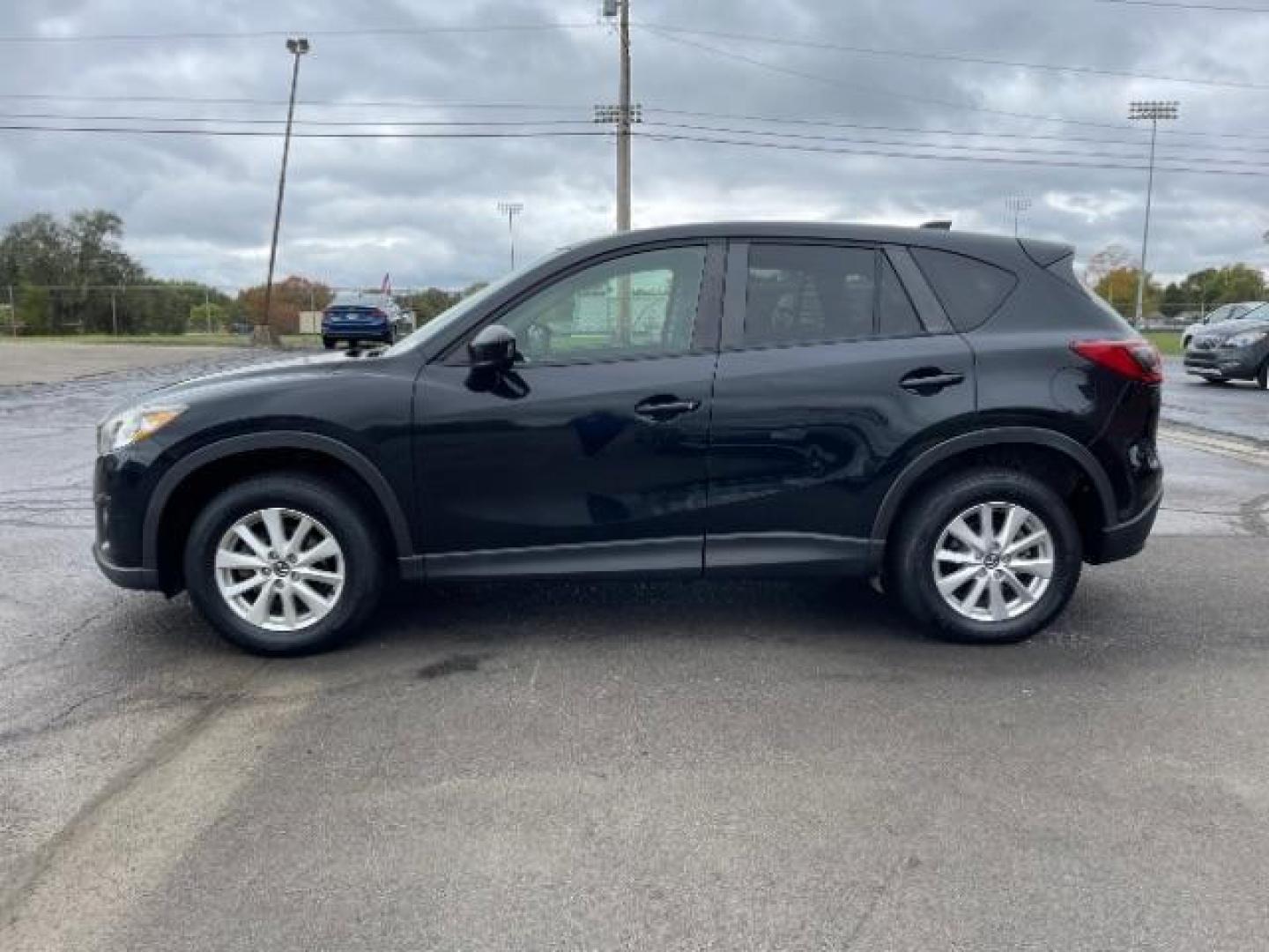 2014 Jet Black Mica Mazda CX-5 Touring AWD (JM3KE4CY2E0) with an 2.5L L4 DOHC 16V engine, 6-Speed Automatic transmission, located at 1230 East Main St, Xenia, OH, 45385, (937) 908-9800, 39.688026, -83.910172 - Photo#4