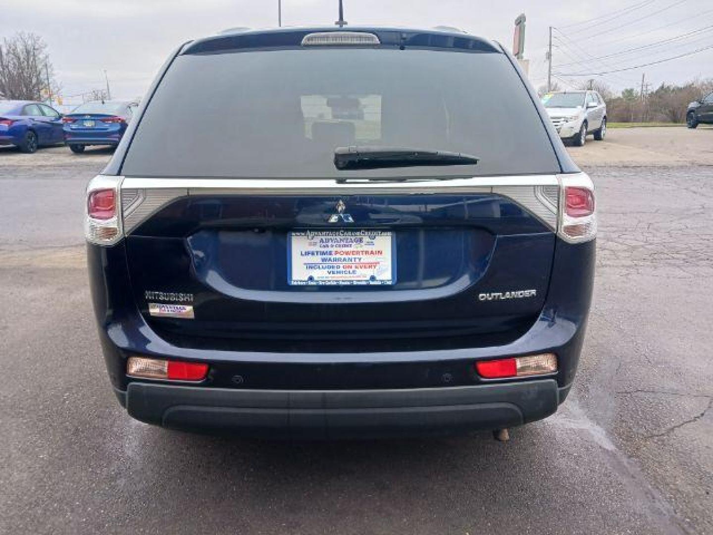 2014 Cosmic Blue Metallic Mitsubishi Outlander SE S-AWC (JA4AZ3A32EZ) with an 2.4L L4 DOHC 16V engine, 6-Speed Automatic transmission, located at 4508 South Dixie Dr, Moraine, OH, 45439, (937) 908-9800, 39.689976, -84.218452 - Photo#5