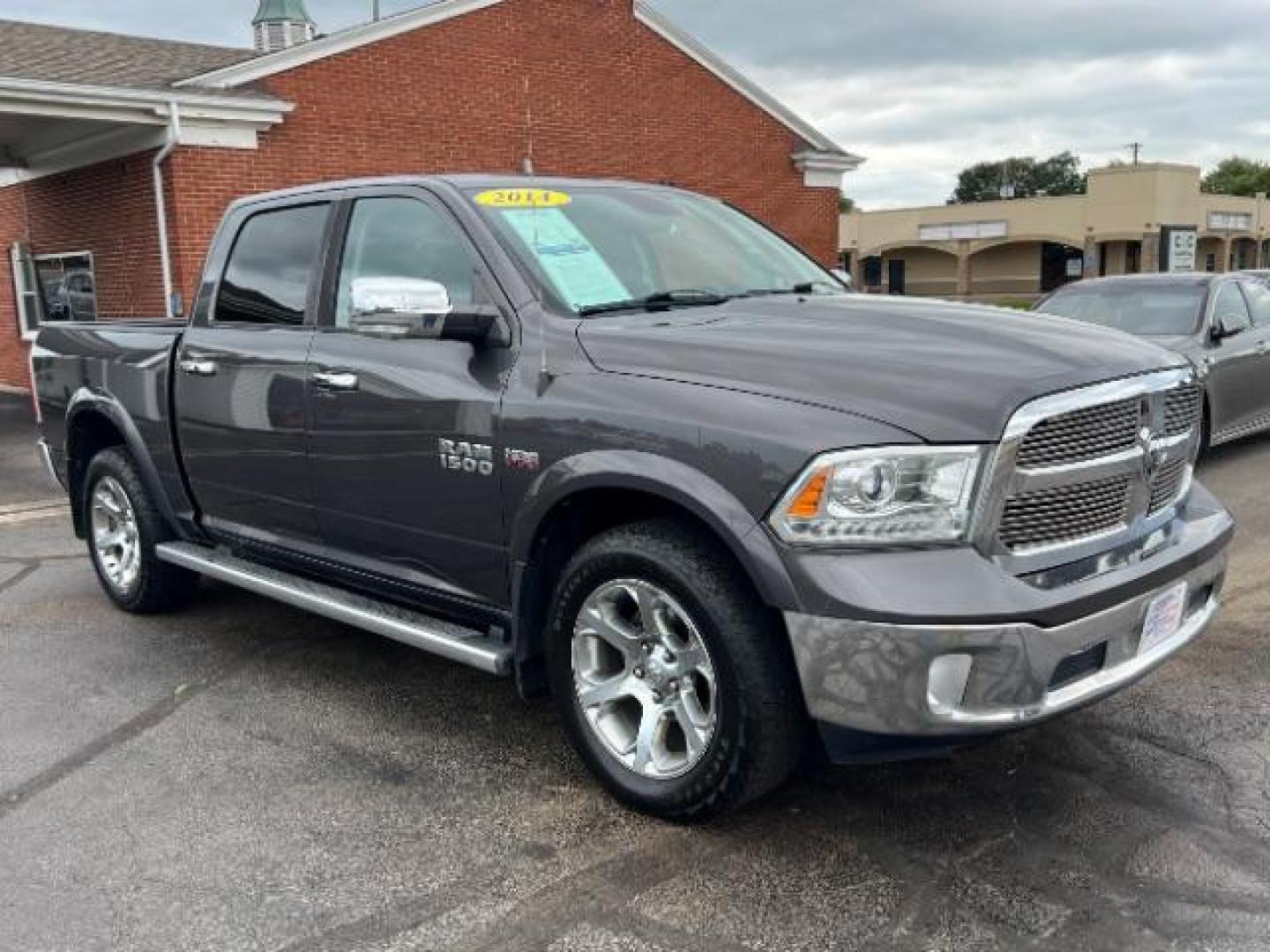 2014 Granite Crystal Met CC RAM 1500 Laramie Crew Cab SWB 4WD (1C6RR7NTXES) with an 5.7L V8 OHV 16V engine, 8-Speed Automatic transmission, located at 1184 Kauffman Ave, Fairborn, OH, 45324, (937) 908-9800, 39.807072, -84.030914 - Photo#0