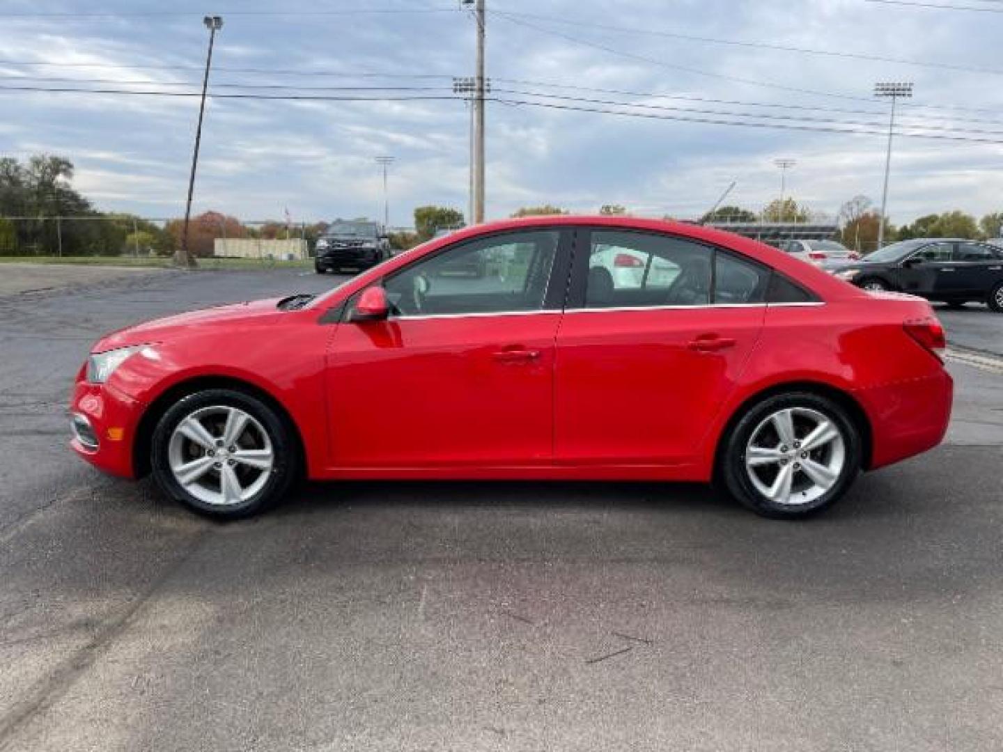 2015 Red Hot Chevrolet Cruze 2LT Auto (1G1PE5SB2F7) with an 1.4L L4 DOHC 16V TURBO engine, 6-Speed Automatic transmission, located at 1184 Kauffman Ave, Fairborn, OH, 45324, (937) 908-9800, 39.807072, -84.030914 - Photo#2