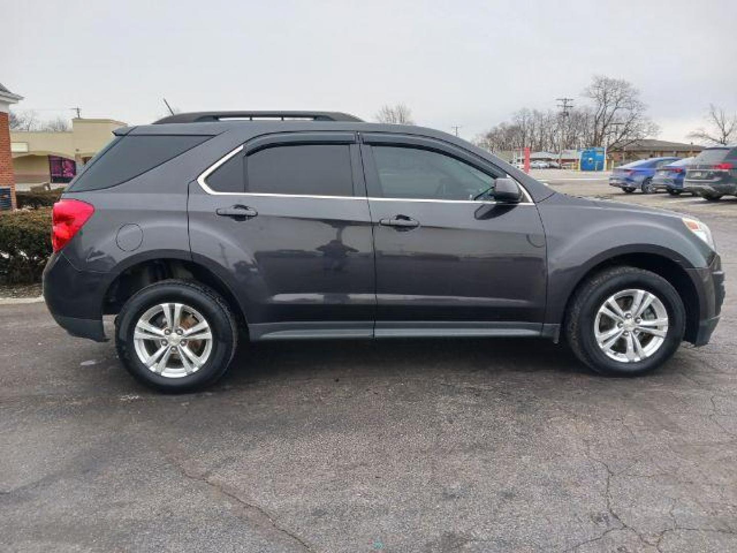 2015 Tungsten Metallic Chevrolet Equinox 1LT 2WD (1GNALBEK9FZ) with an 2.4L L4 DOHC 16V FFV engine, 6-Speed Automatic transmission, located at 1099 N County Rd 25A , Troy, OH, 45373, (937) 908-9800, 40.057079, -84.212883 - Photo#4